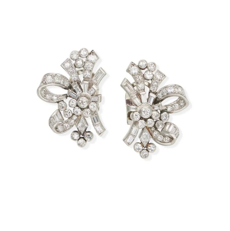 MID CENTURY 1950'S PLATINUM AND DIAMOND EARRINGS Of floral spray design set with brilliant, single, baguette and kite-cut diamonds, estimated total diamond weight 1.00 carats, mounted in platinum,