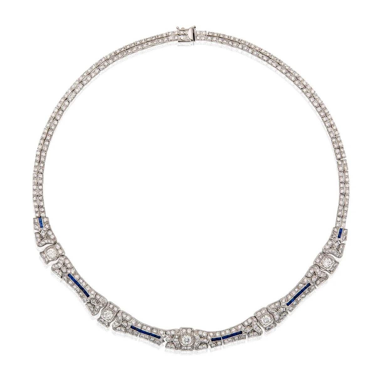 ART DECO DIAMOND, SAPPHIRE WHITE GOLD NECKLACE Of geometric design, set with old European circular and single cut diamonds, with blue coloured stones accents.