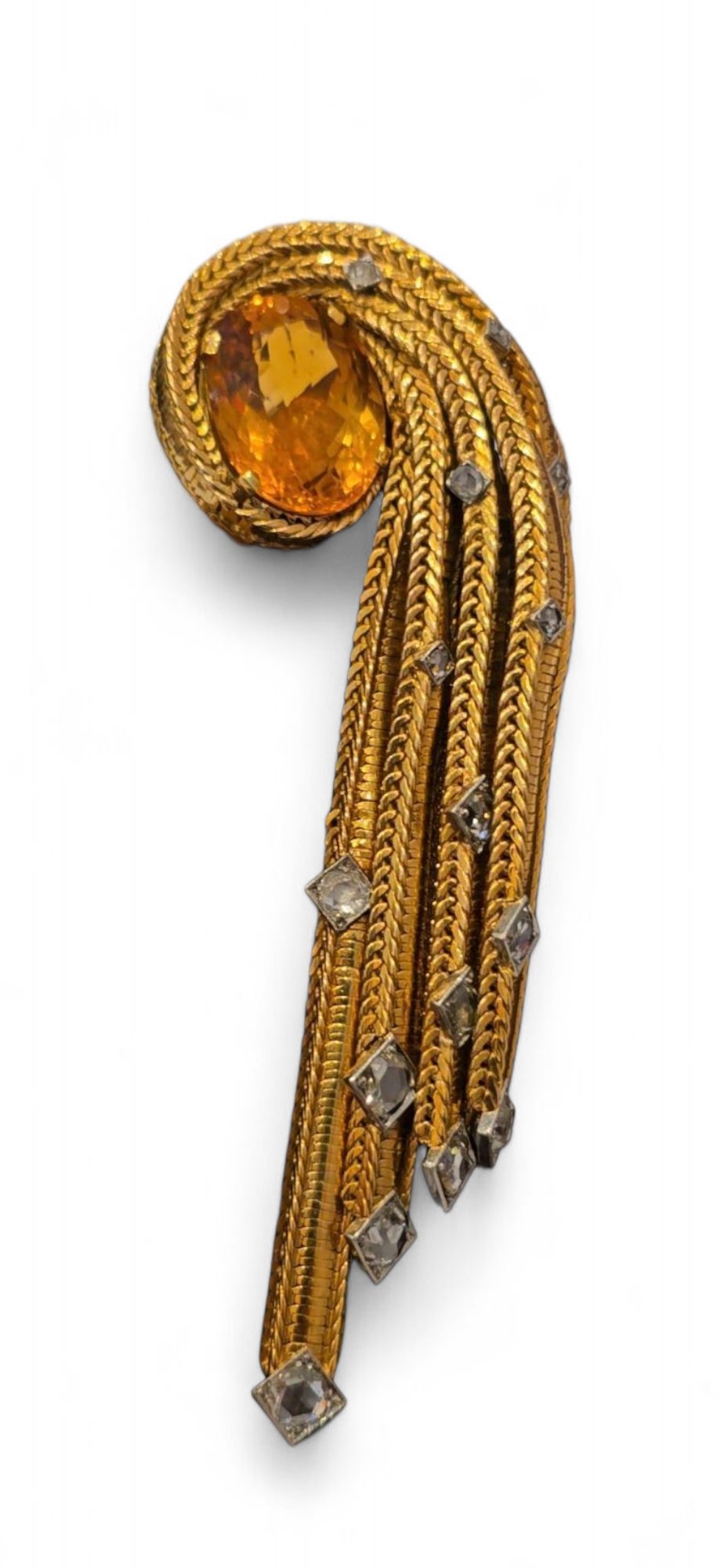 Sterlé 1950's Gold, Citrine & Diamond Brooch
A central oval citrine is framed by cascading gold chains set with rose cut diamonds. Signed  Sterlé Paris, numbered 3498 with French and maker's marks. 59.3 grams. Paris, early 1950’s