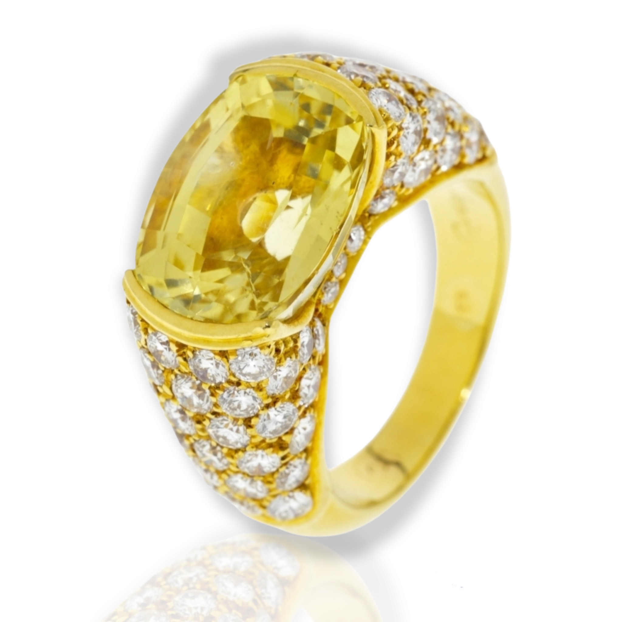 1970'S CARTIER YELLOW SAPPHIRE AND GOLD RING Centering upon a yellow sapphire circa 9 cts set East-to-West to the 18kt yellow gold ring with round brilliant cut diamonds paved to the shoulders. French marks, signed Cartier Paris and numbered 229235, 