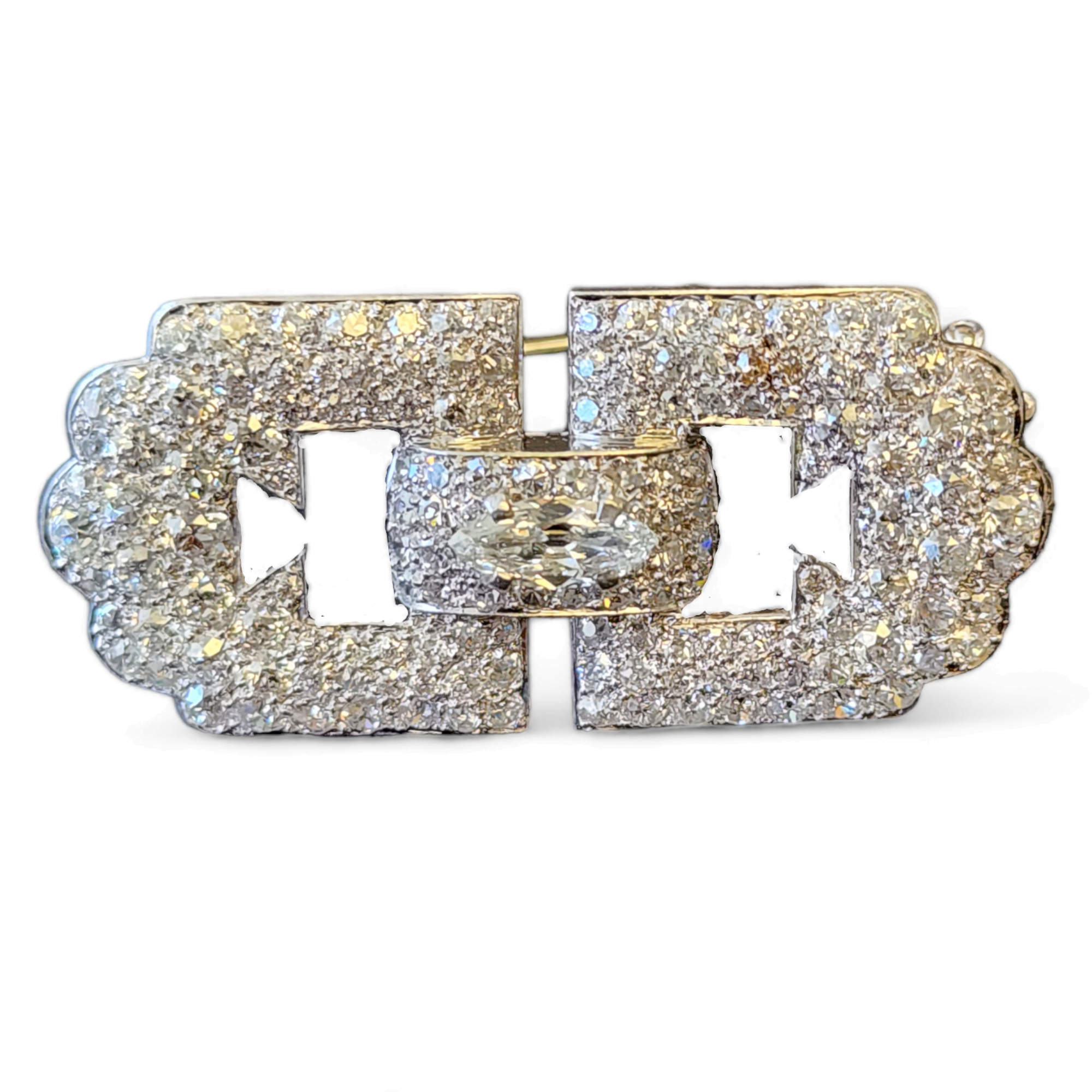 CARTIER ART DECO PLATINUM AND DIAMOND BROOCH. Geometrical Link design pave set with 150 round diamonds circa 6 cts and a marquise diamond circa 0.6 cts. Signed Cartier and numbered 3015704. circa 1920.