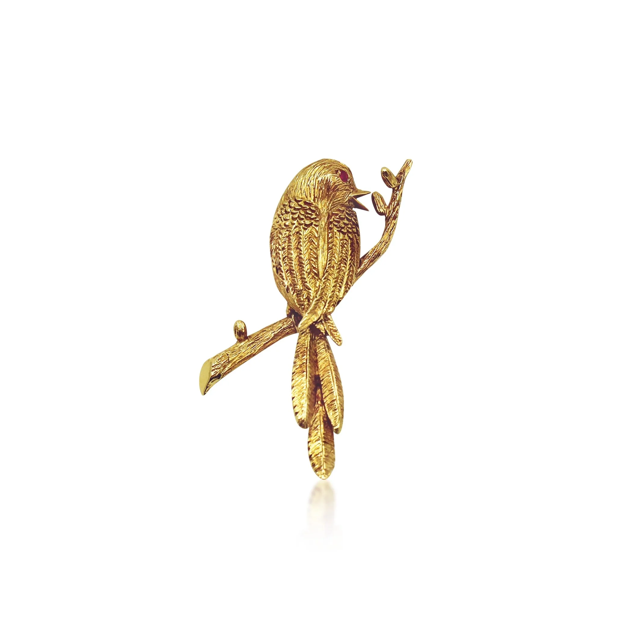 BOUCHERON, MID CENTURY GOLD AND RUBY BIRD ON A BRANCH BROOCH