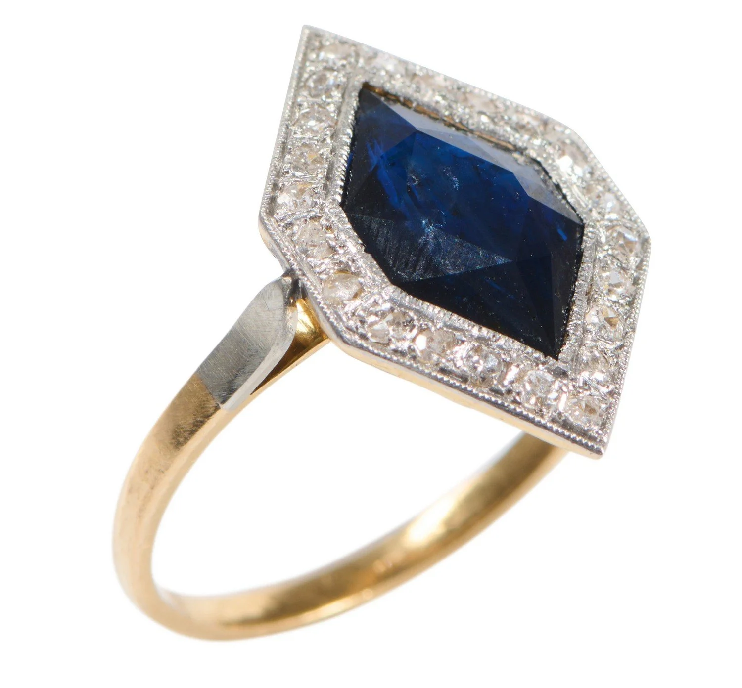 FRENCH ART DECO 1920'S PLATINUM AND GOLD, SAPPHIRE AND DIAMOND RING. Platinum topped 18kt gold ring with a central fancy cut blue sapphire surrounded by bead set single cut diamonds, ring size 55, French marks.