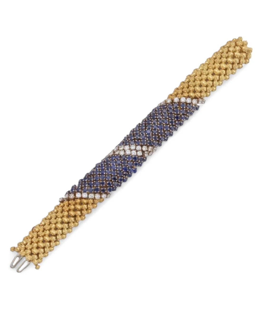 1970's GOLD, SAPPHIRE AND DIAMOND "COUS-COUS" BRACELET The highly articulated domed bracelet of textured 18kt gold beads set with two bands of round sapphires and round diamonds.