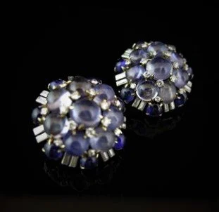 1950's SAPPHIRE AND DIAMOND EARRINGS
set with cabochon star sapphires and sapphires
weighing approximately 63 carats, accented by baguette
and round diamonds weighing approximately 3.75
carats, mounted in 18 karat gold and platinum, diameter
approxim