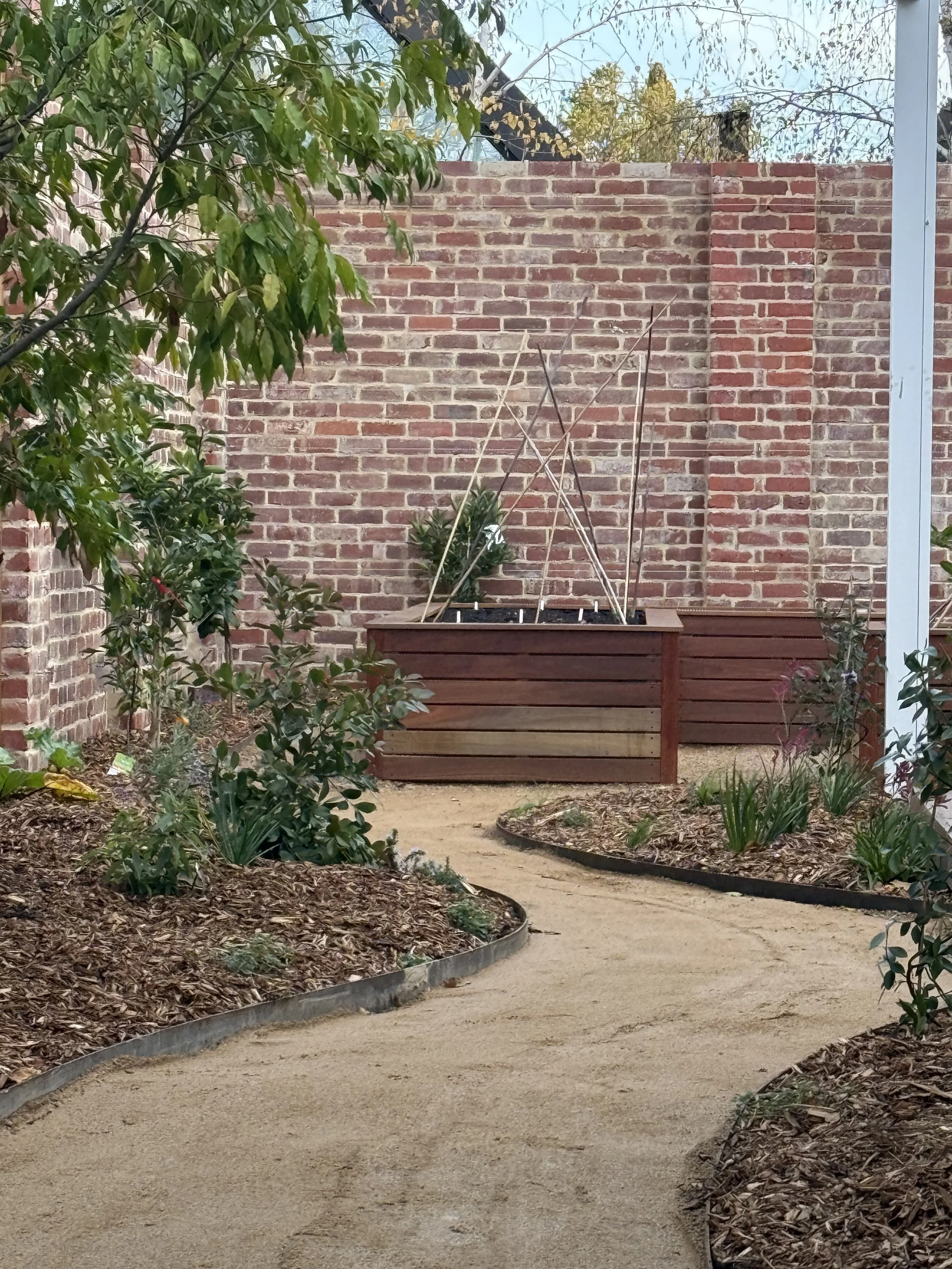 Pathway leading to brick wall