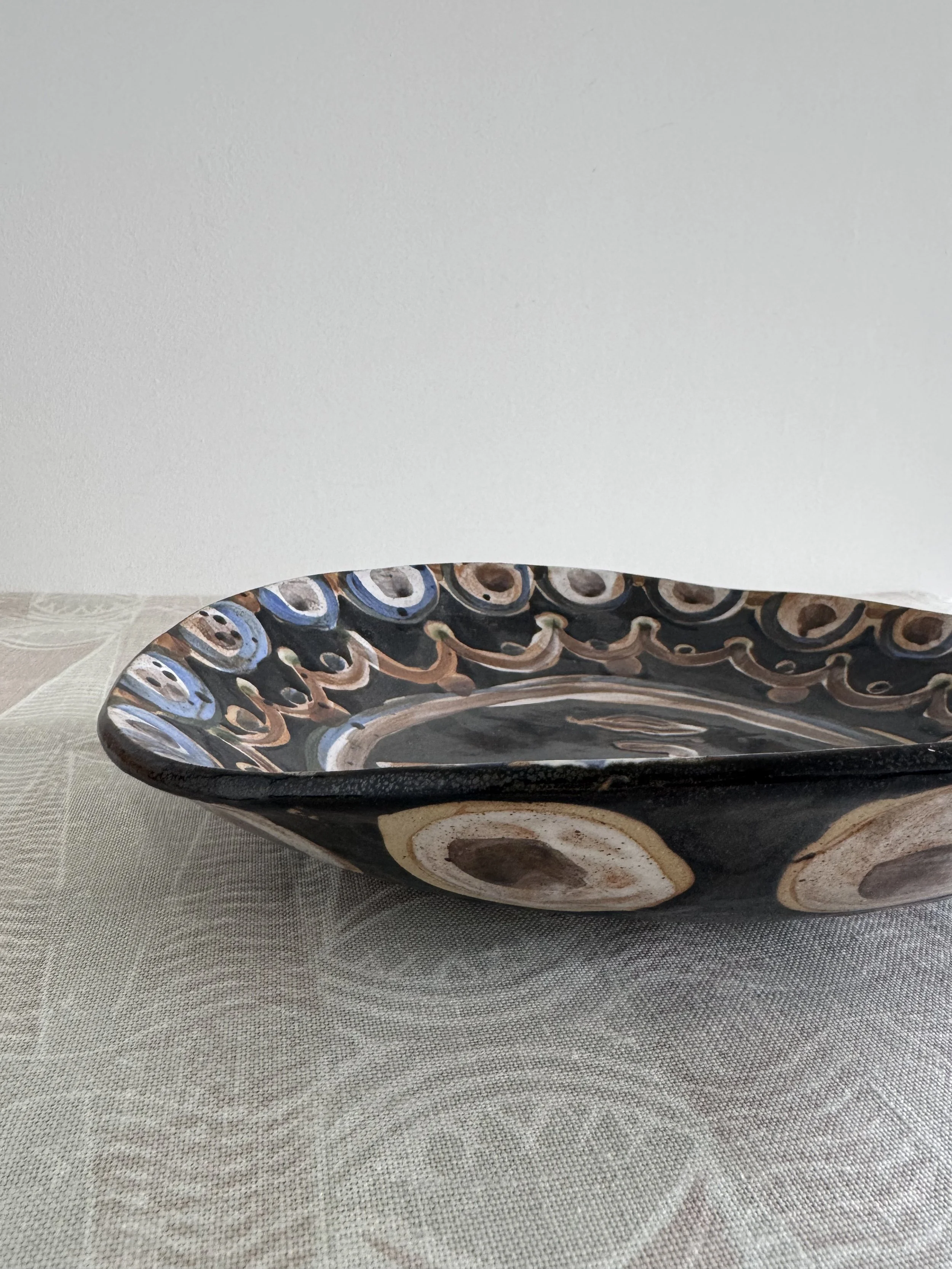 Handmade ceramic face plates by Charlotte Salt