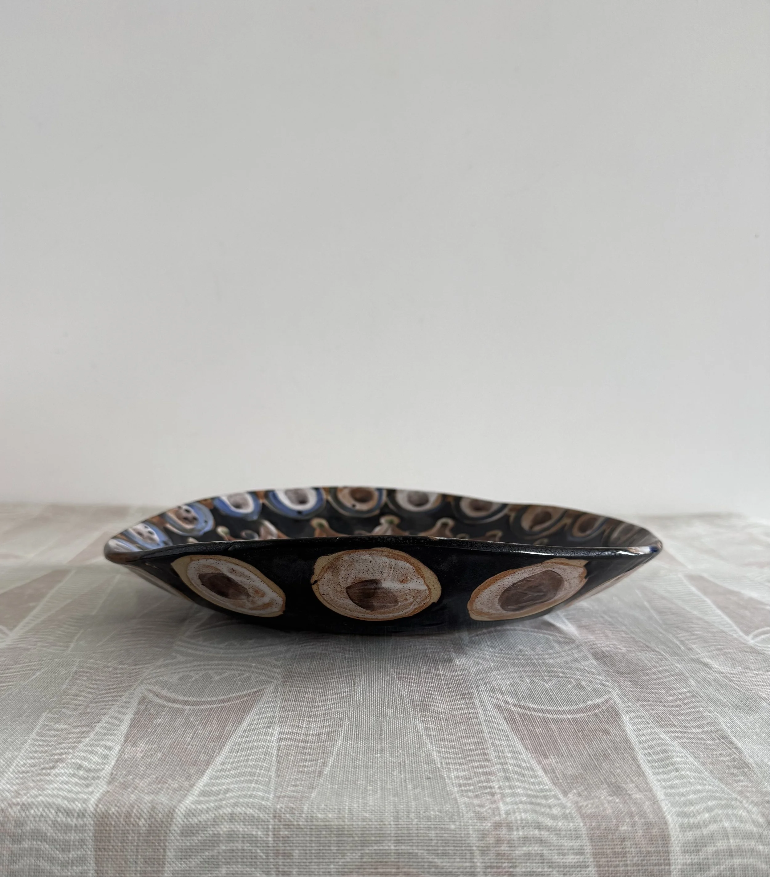 Handmade ceramic face plates by Charlotte Salt