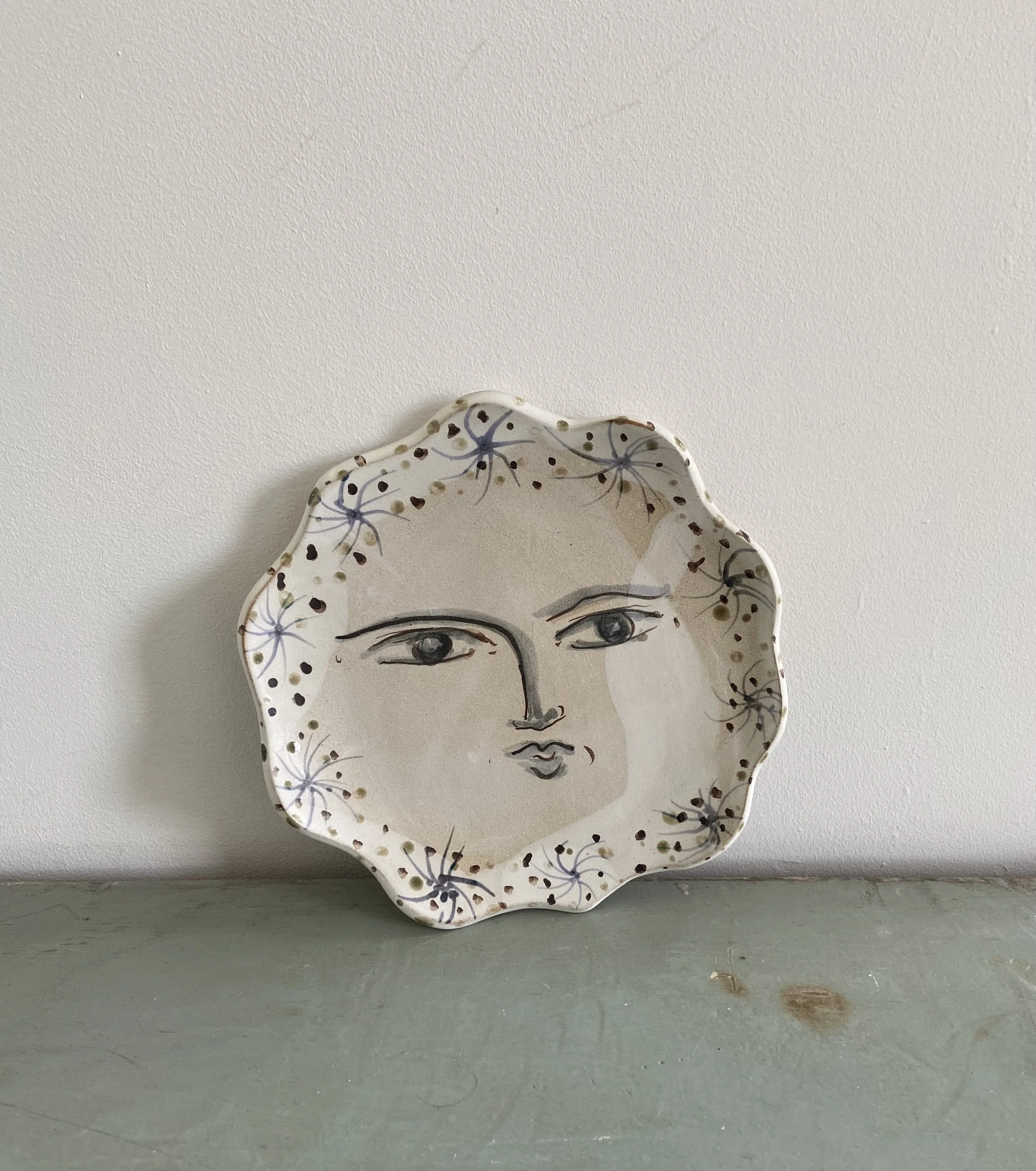 Ceramic face plates by Charlotte Salt