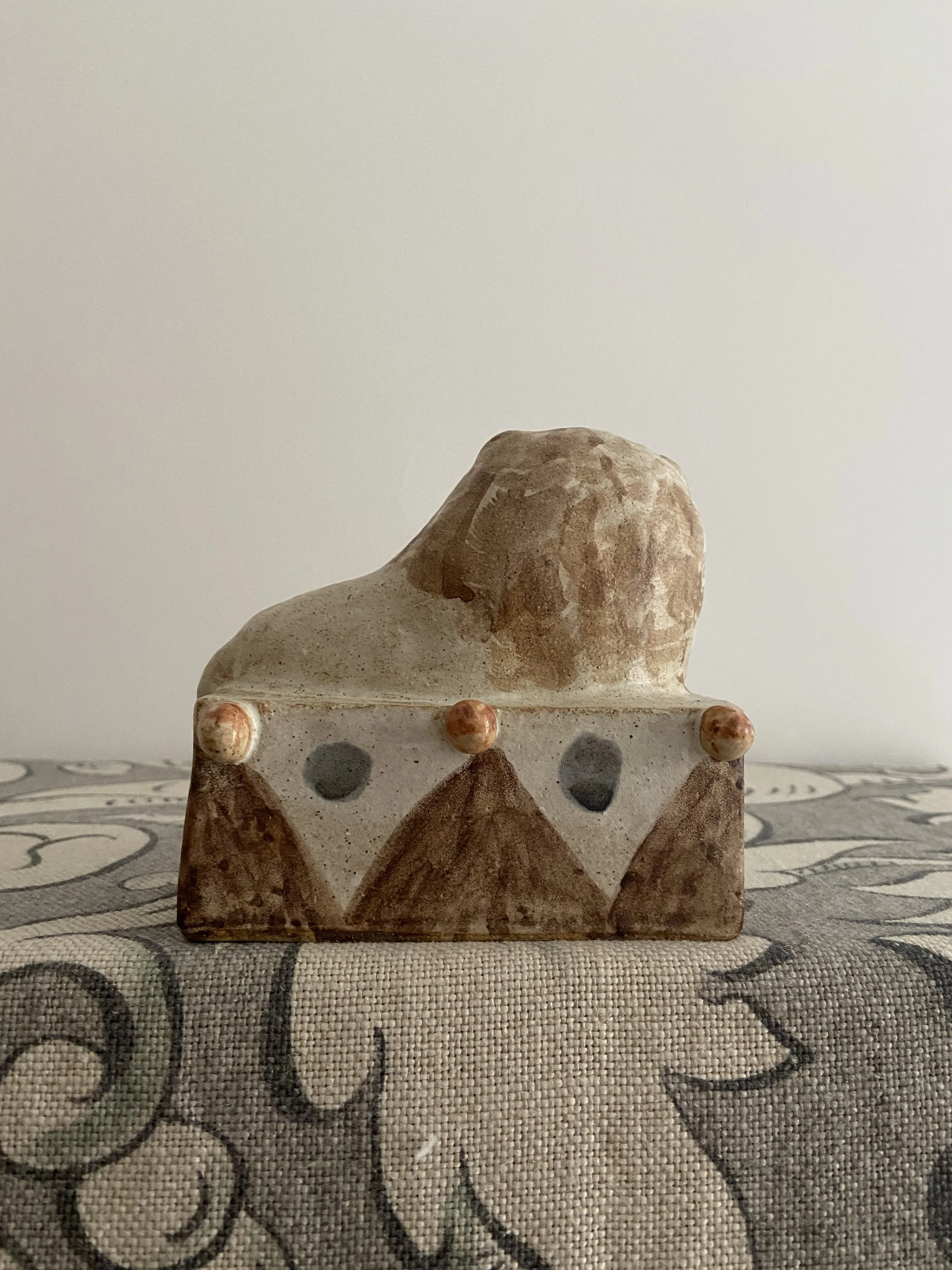 Stoneware lions by Charlotte Salt