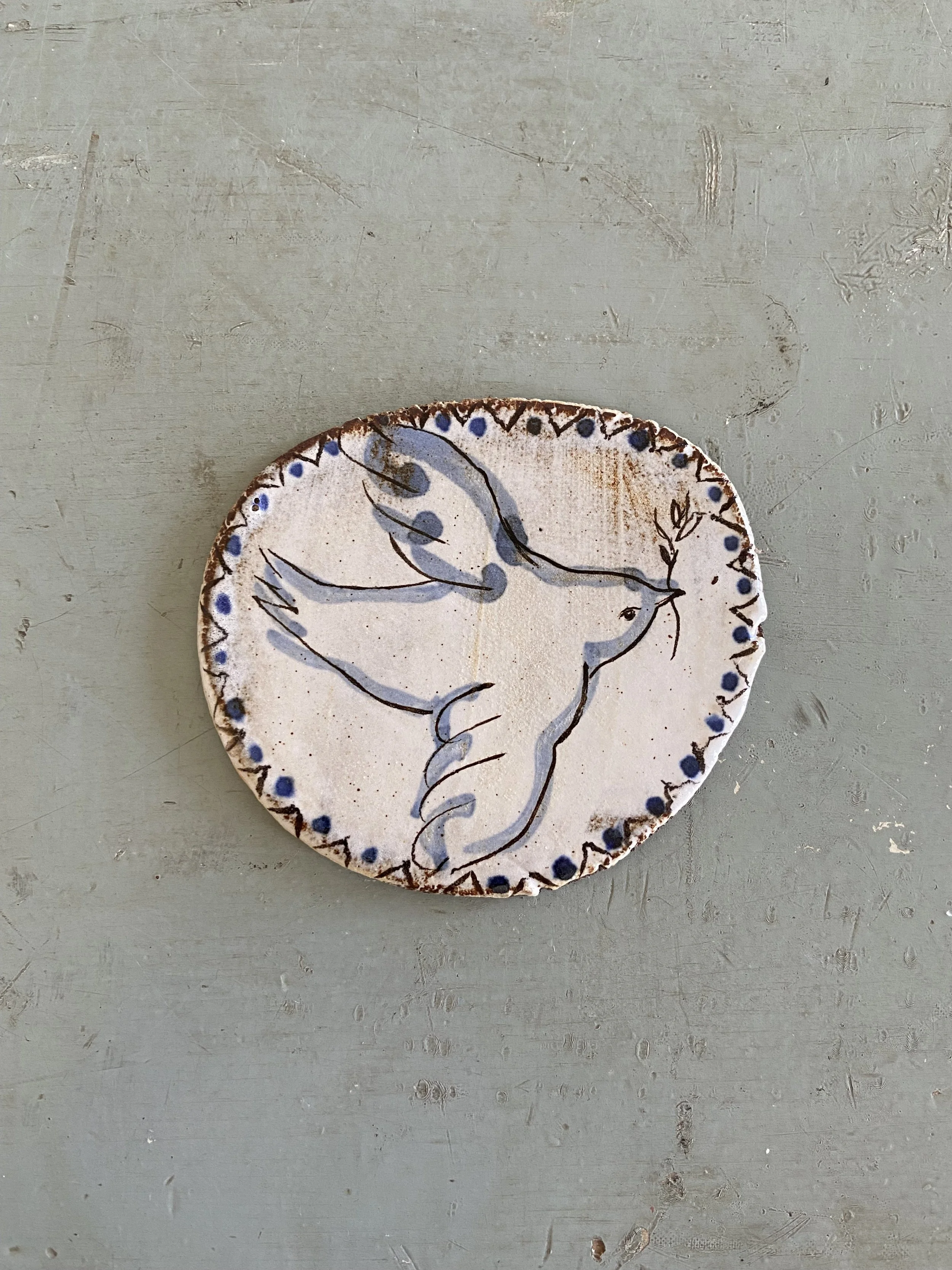 Ceramic bird tile by Charlotte Salt