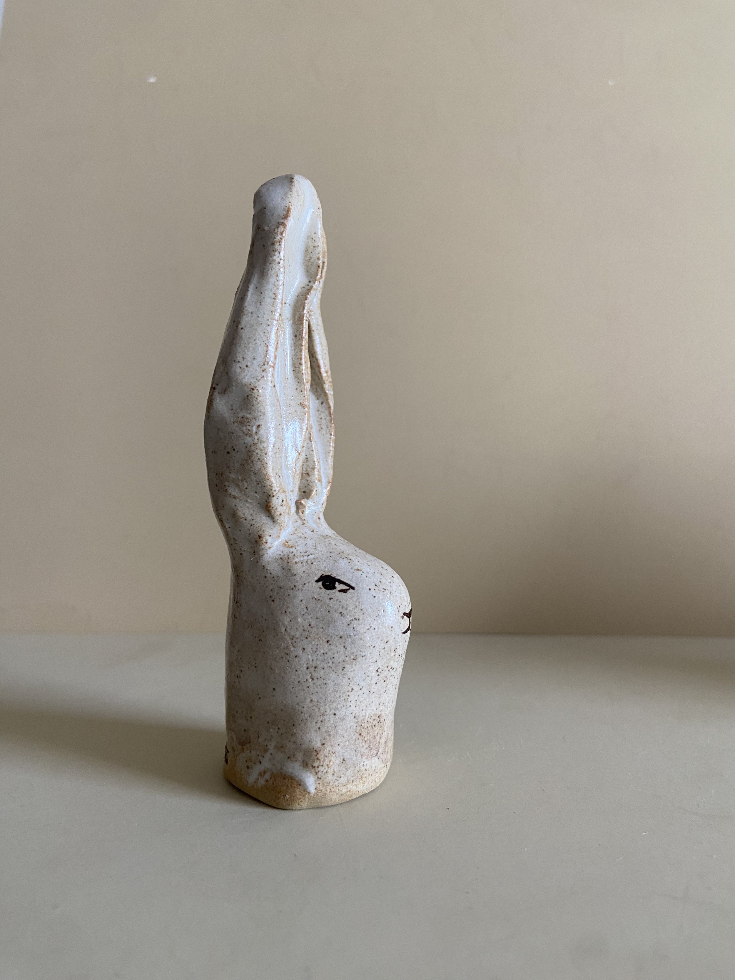 Two ceramic rabbit heads by Charlotte Salt