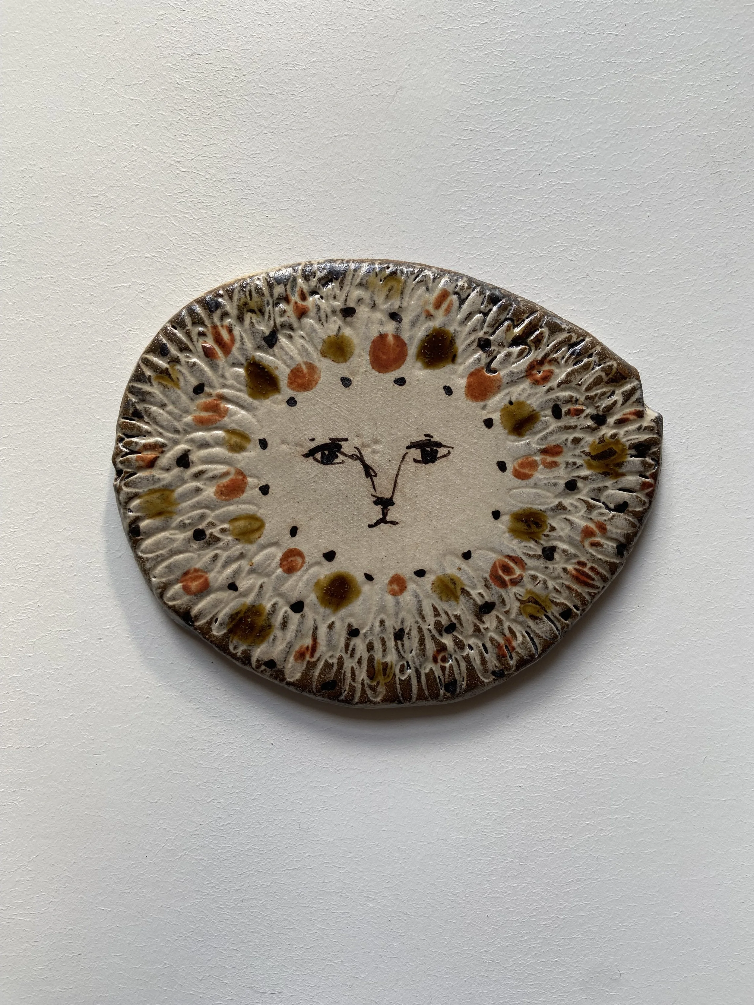 lion face tile by Charlotte Salt