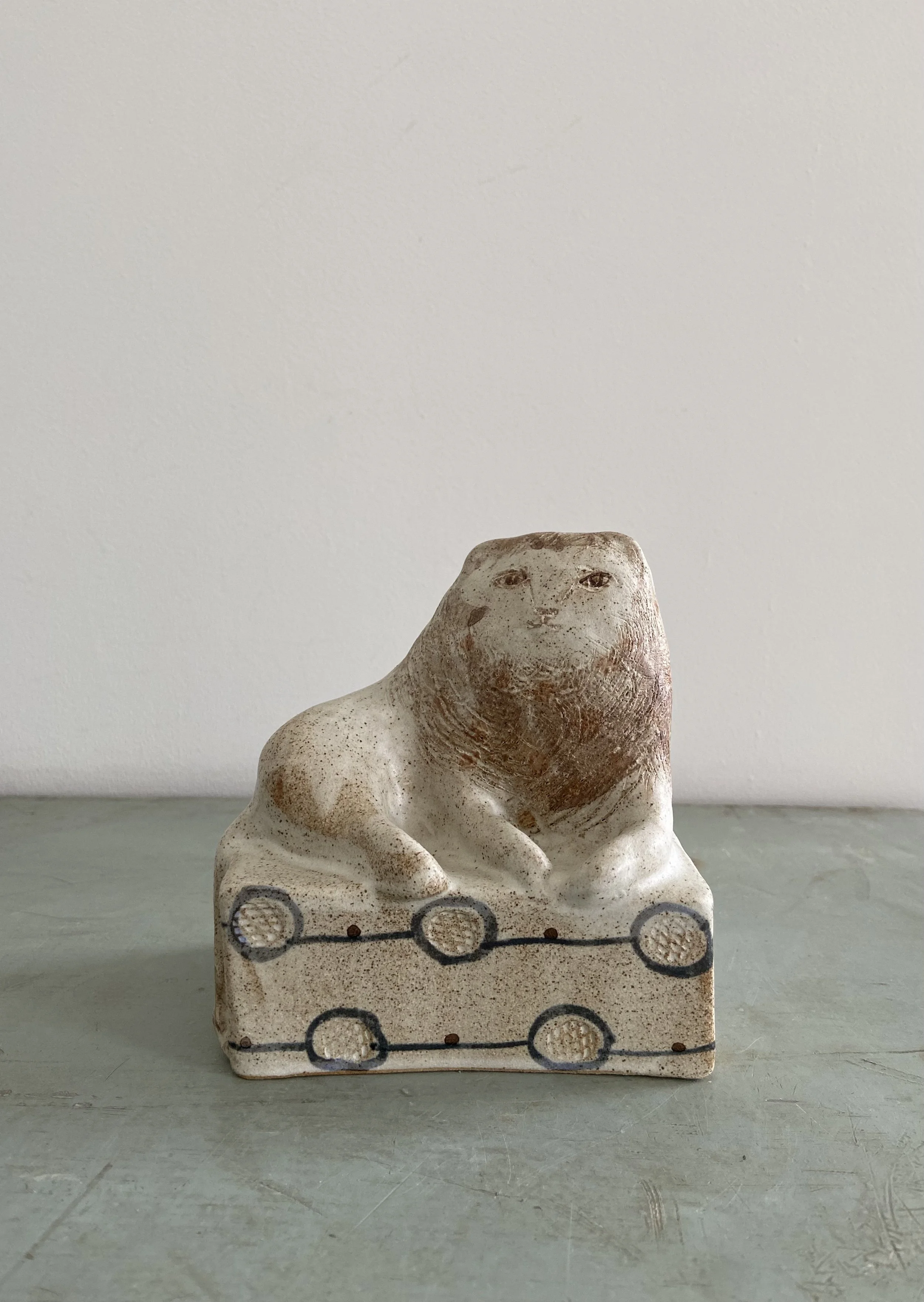 Handmade stoneware lions by Charlotte salt