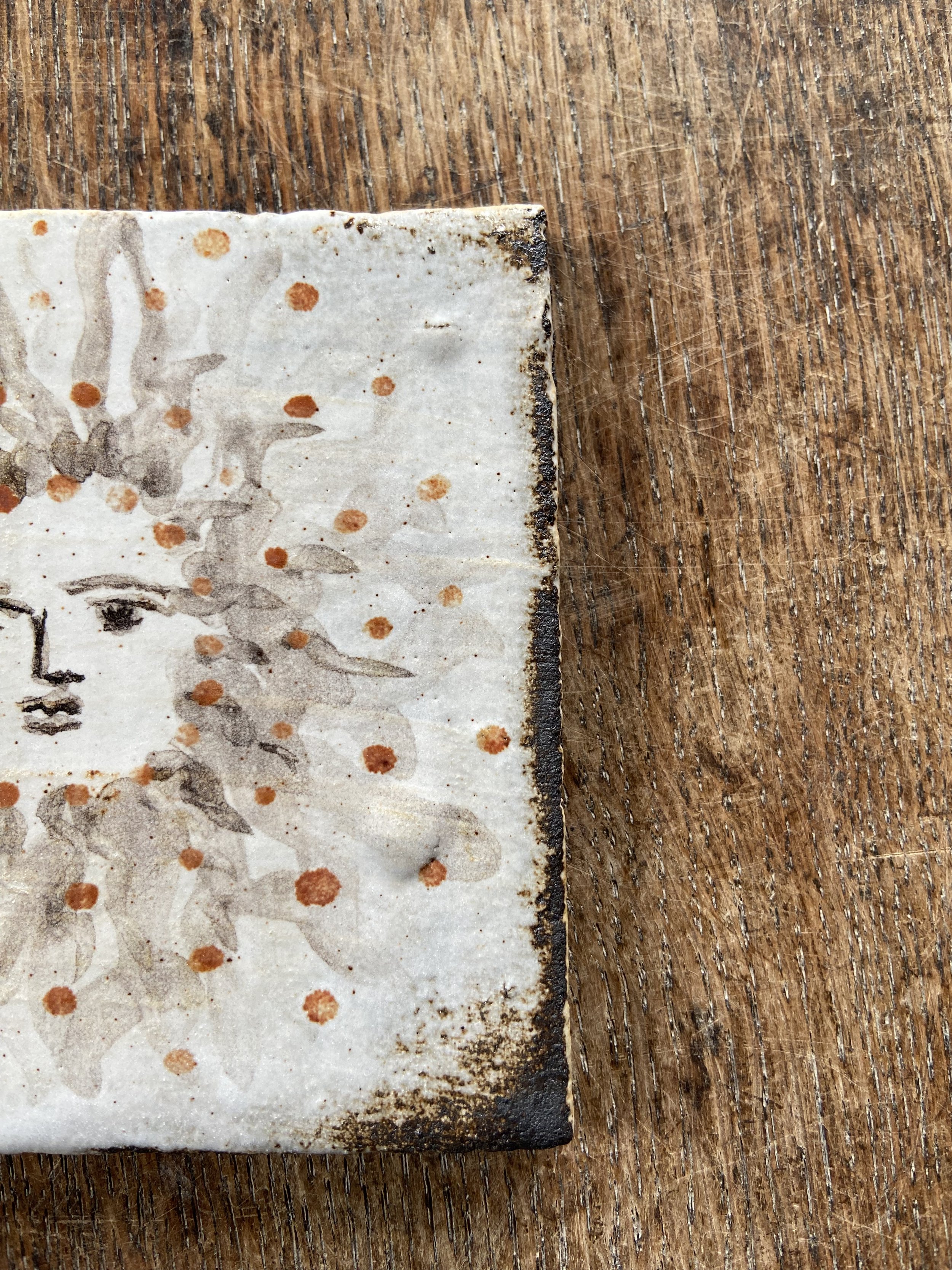 Handmade sun design tile by Charlotte Salt