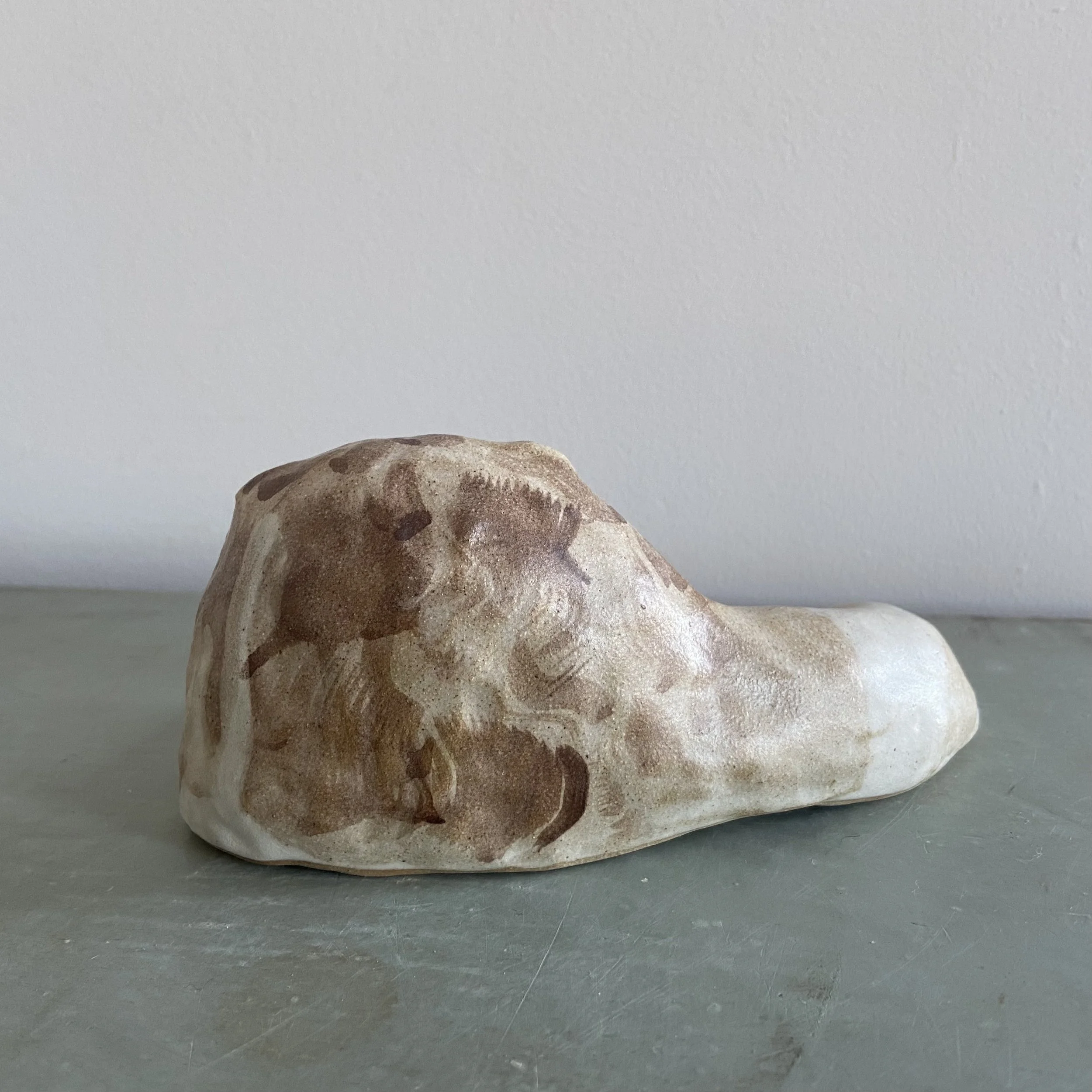 Ceramic lions by Charlotte Salt