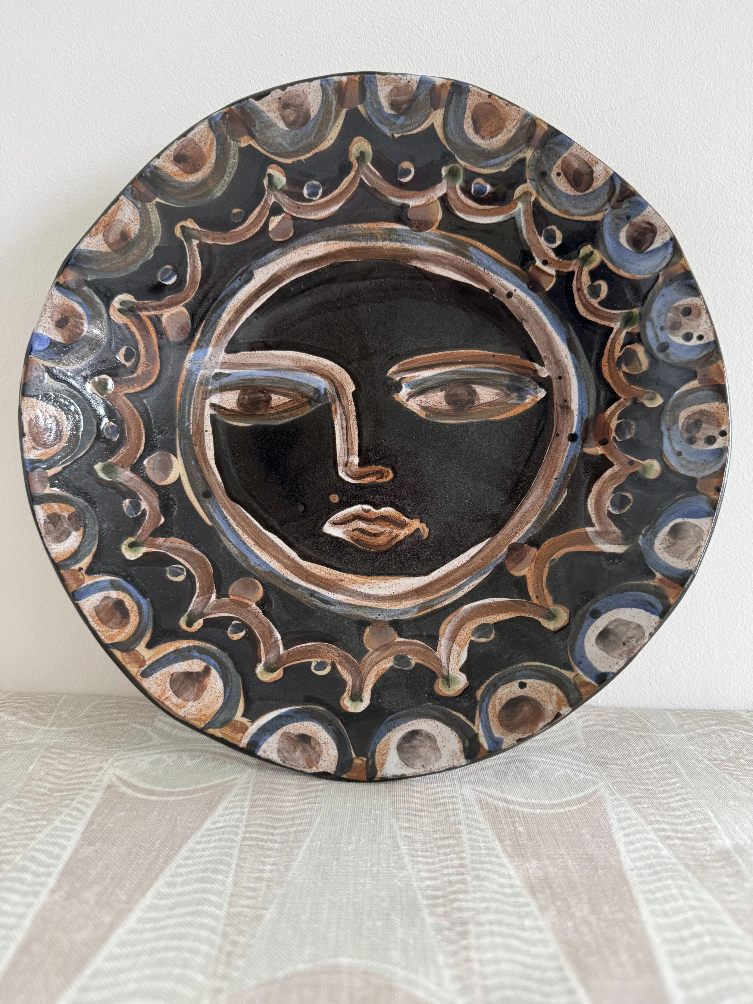 Handmade ceramic face plates by Charlotte Salt