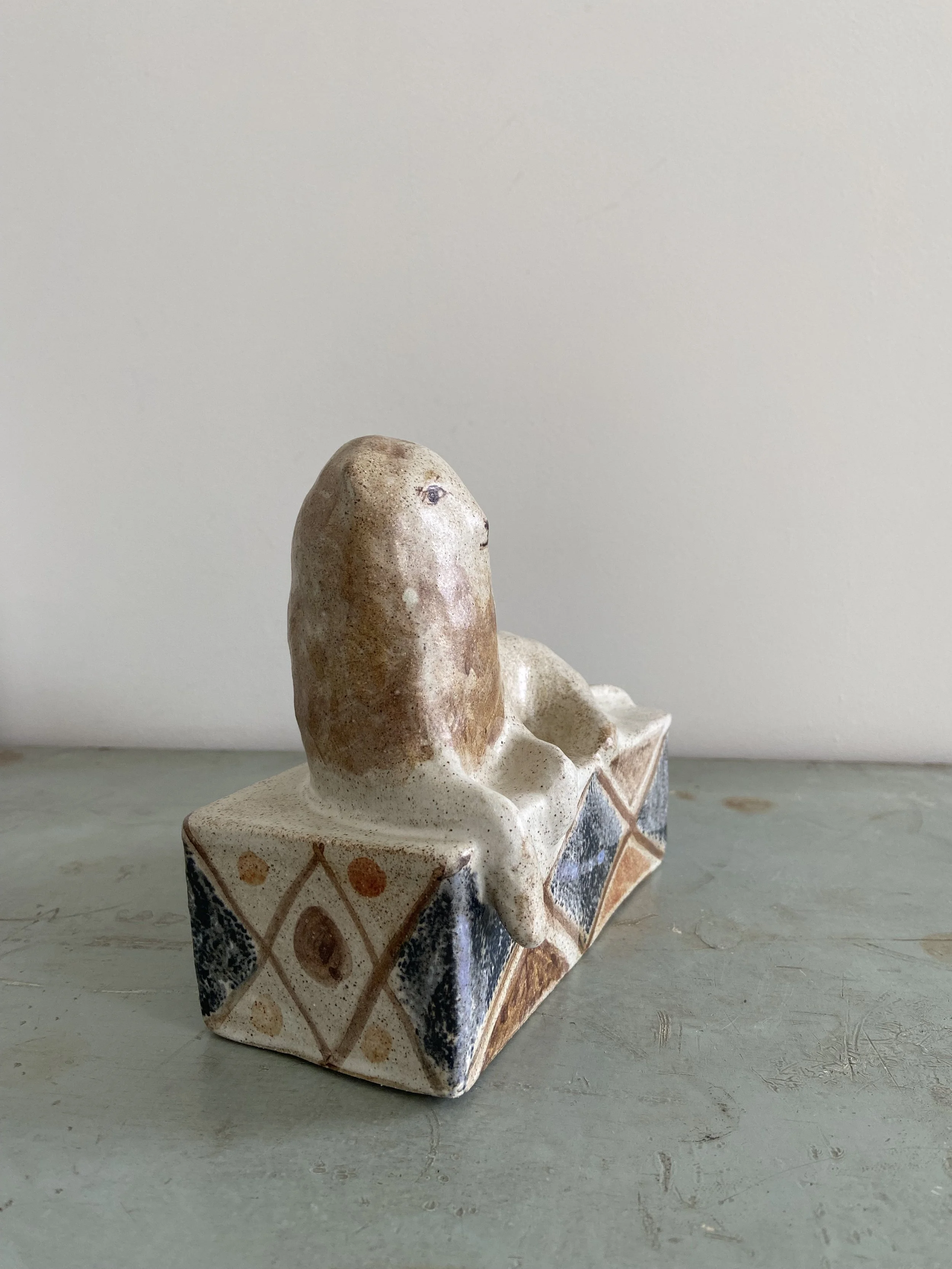 Handmade stoneware lions by Charlotte salt