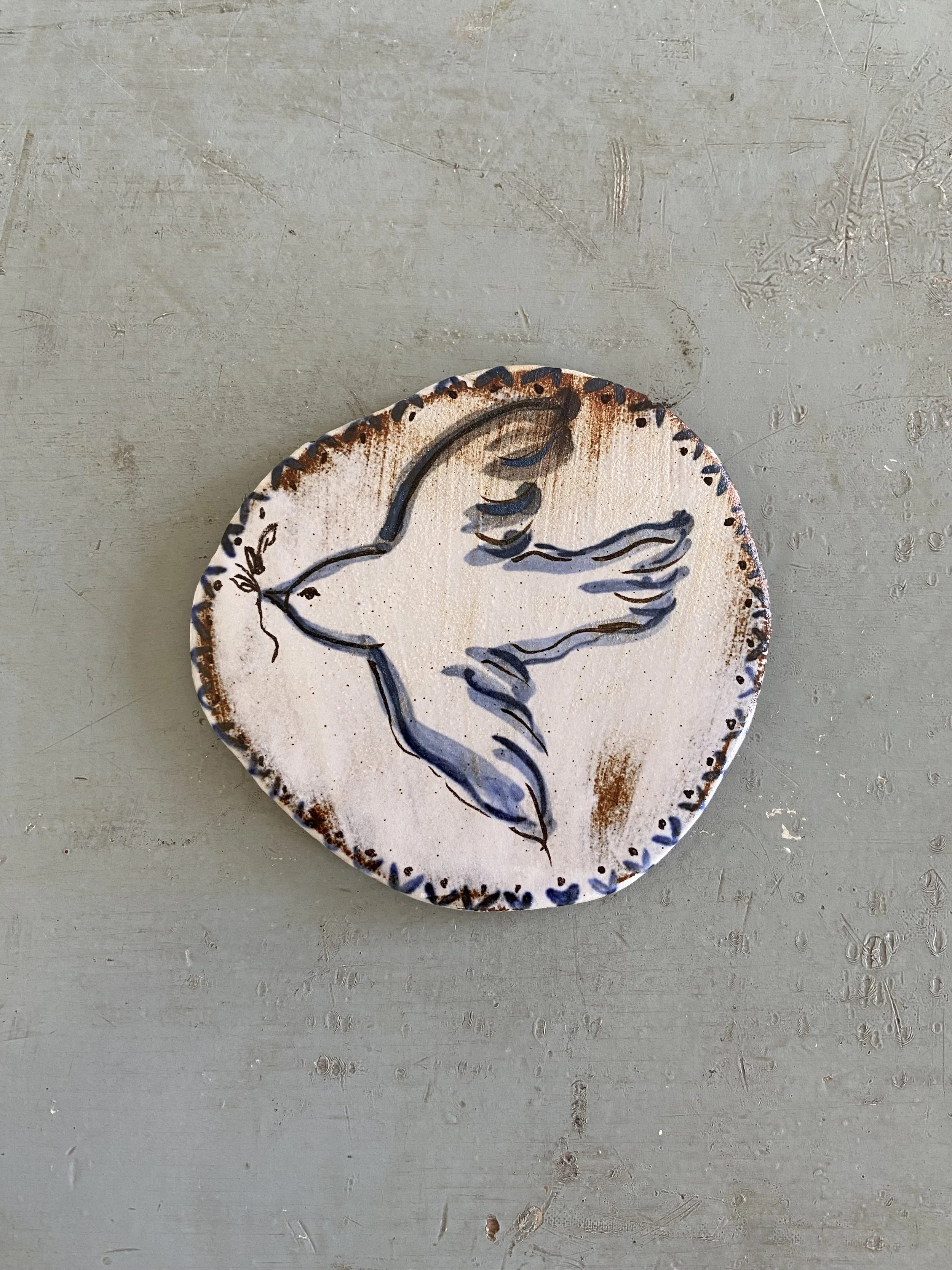 Ceramic bird tile by Charlotte Salt