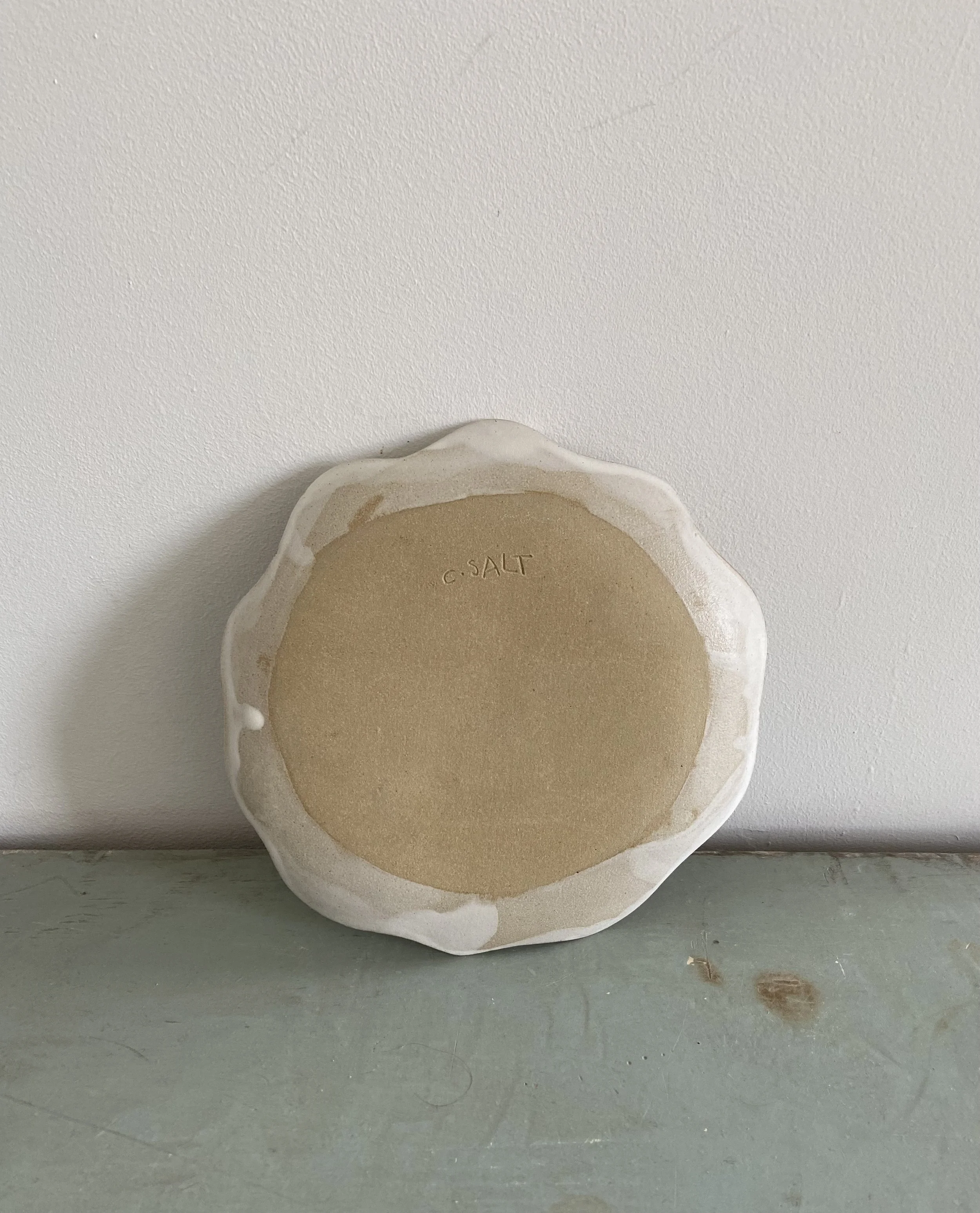 Ceramic face plates by Charlotte Salt