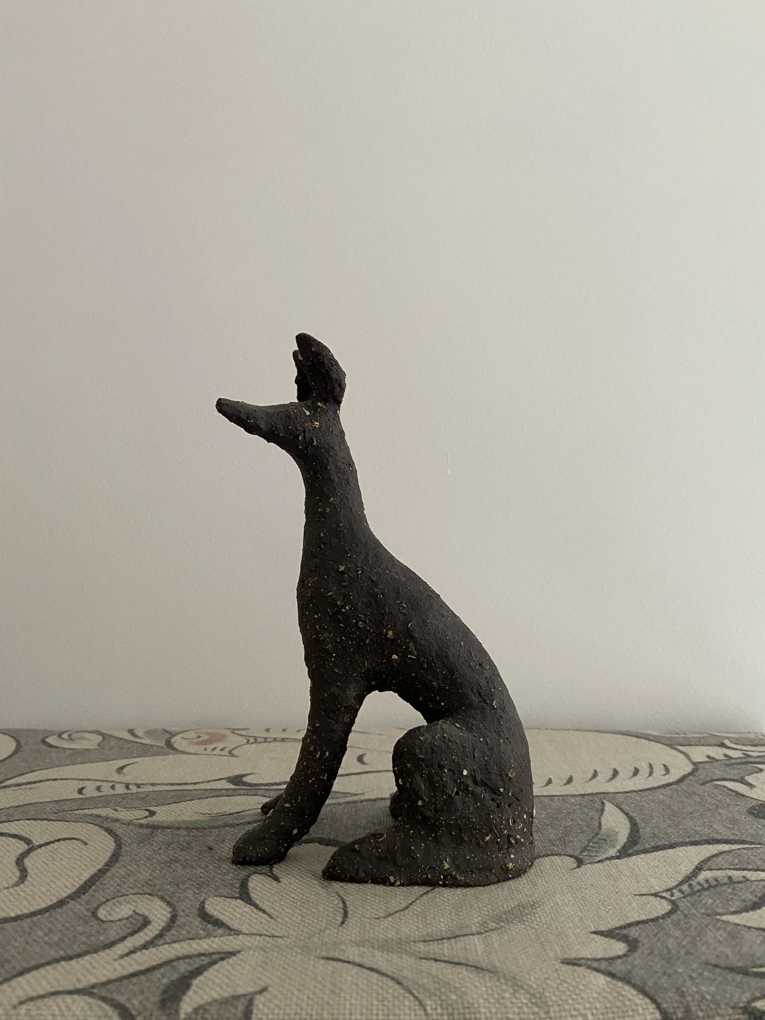 Stoneware seated hounds by Charlotte Salt