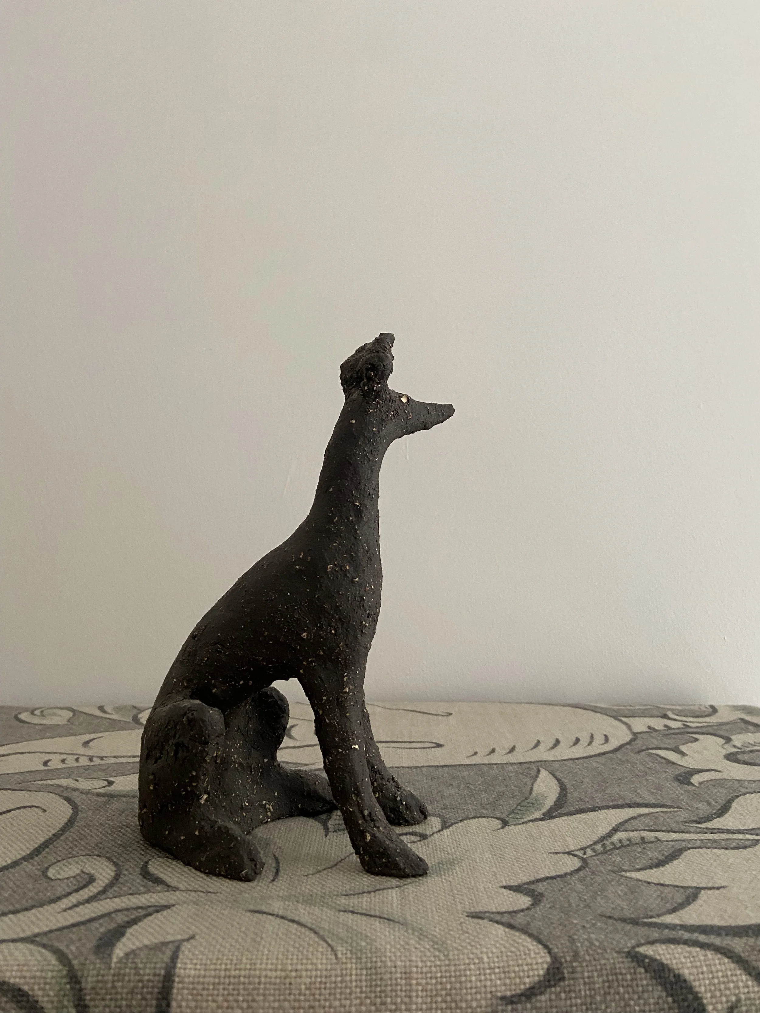 Stoneware seated hounds by Charlotte Salt