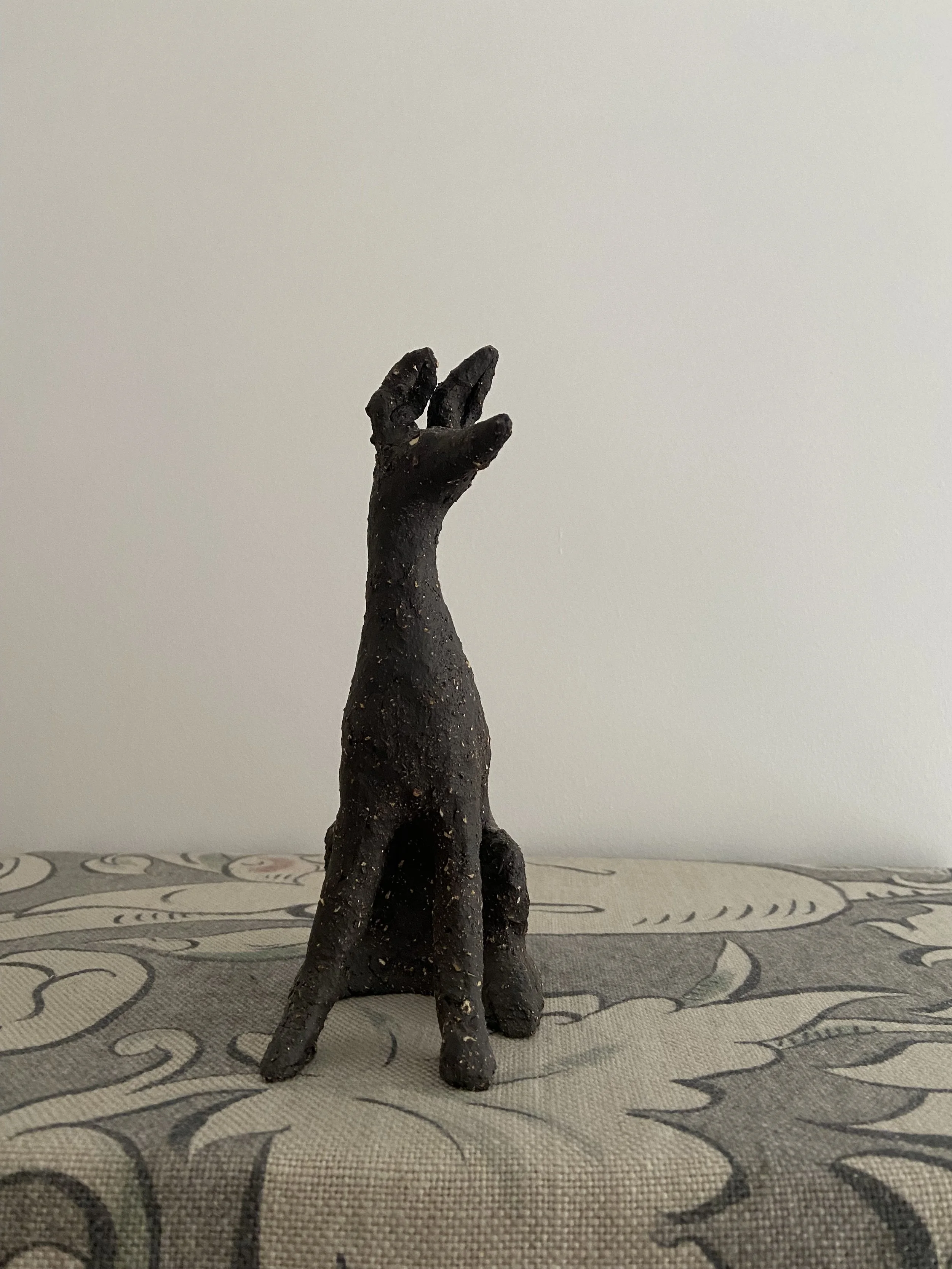 Stoneware seated hounds by Charlotte Salt