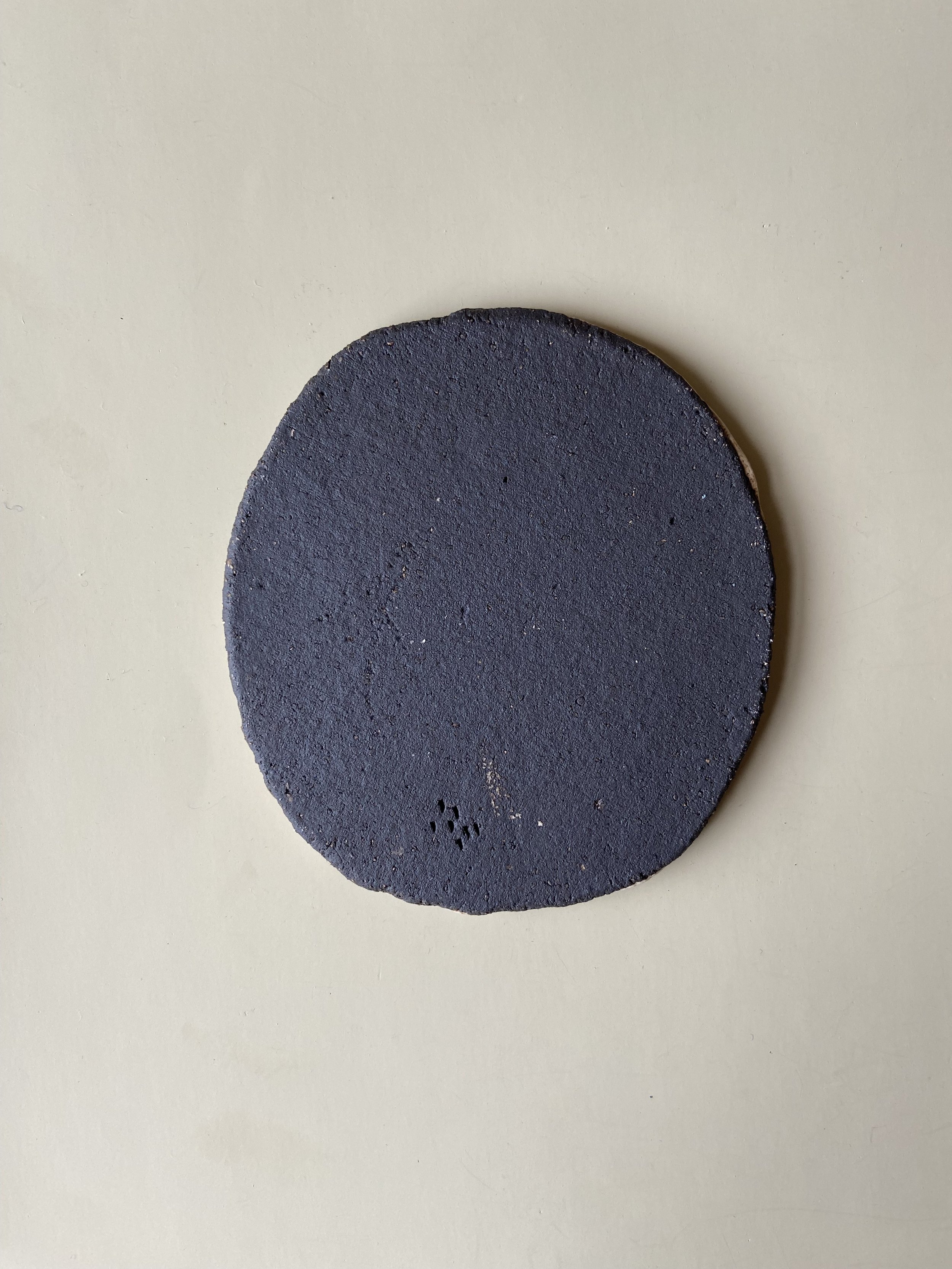 Handmade lion face tile by Charlotte Salt