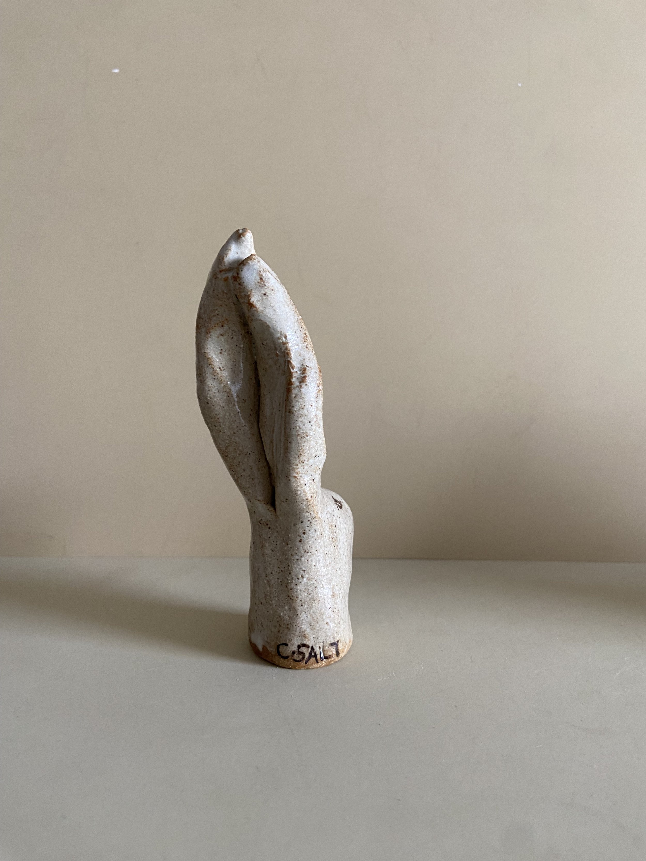 Two ceramic rabbit heads by Charlotte Salt