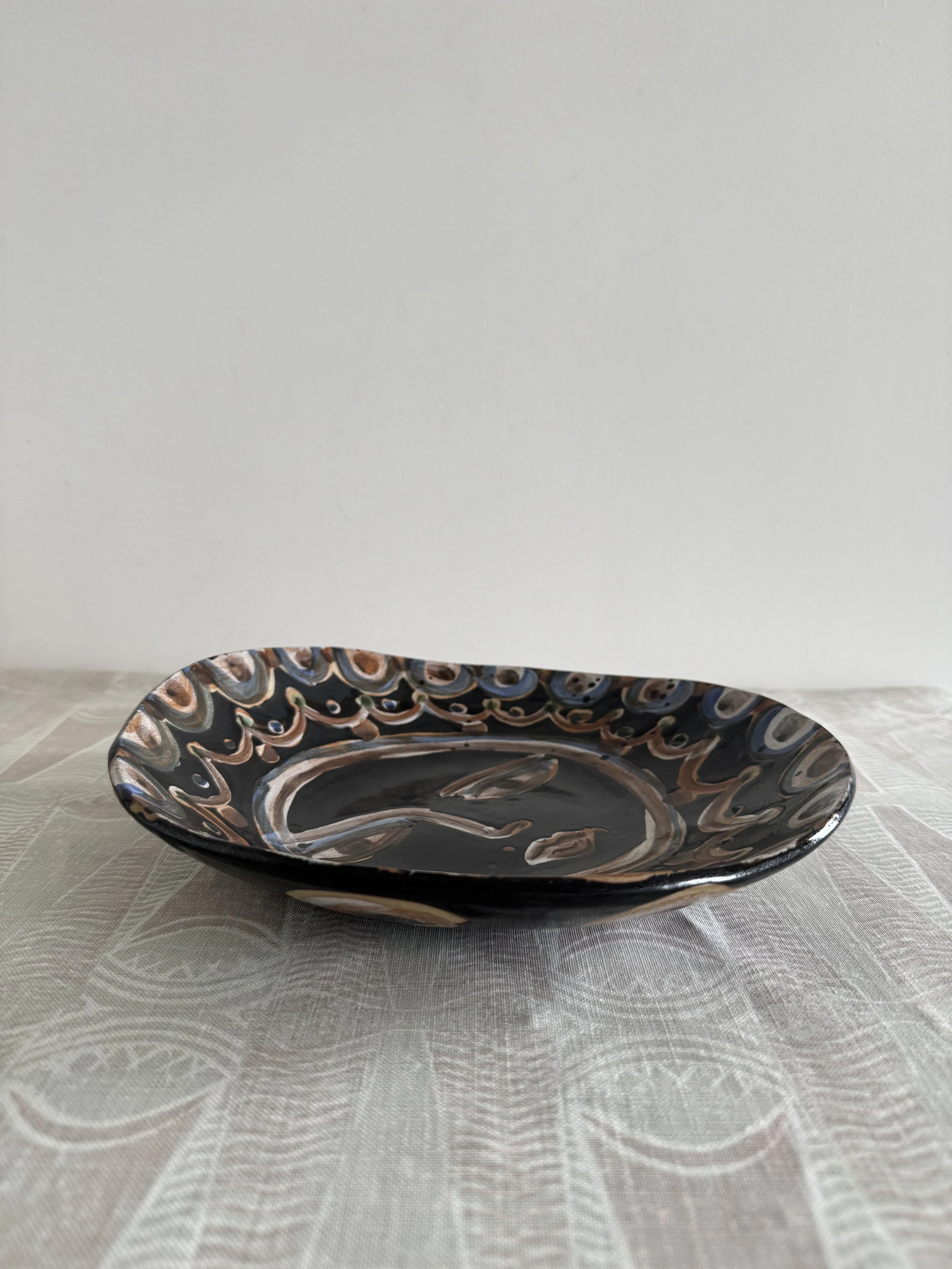 Handmade ceramic face plates by Charlotte Salt