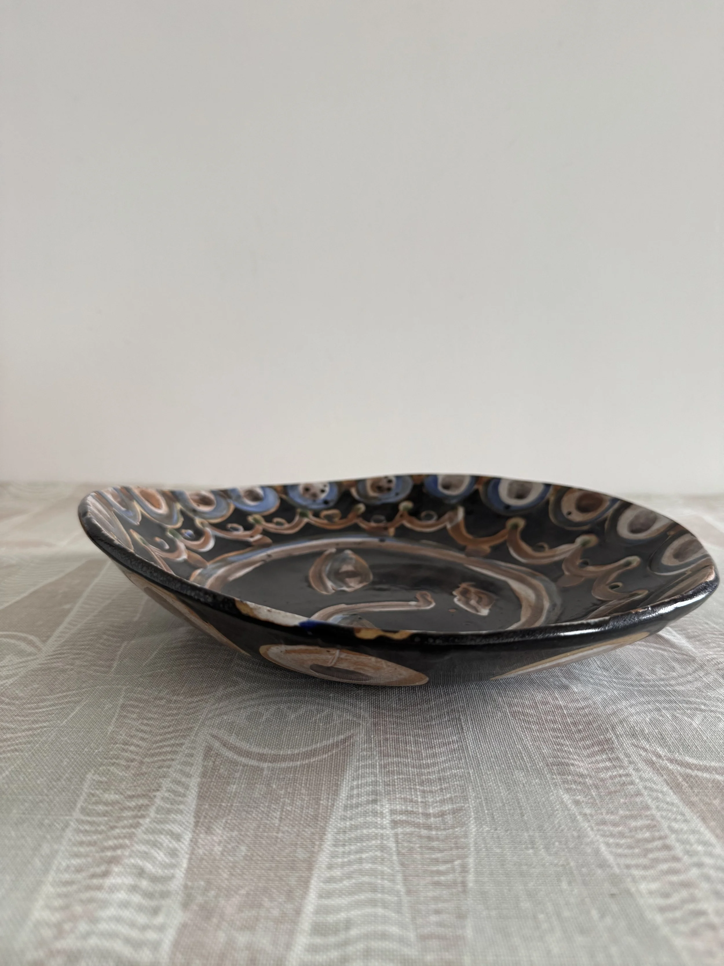 Handmade ceramic face plates by Charlotte Salt