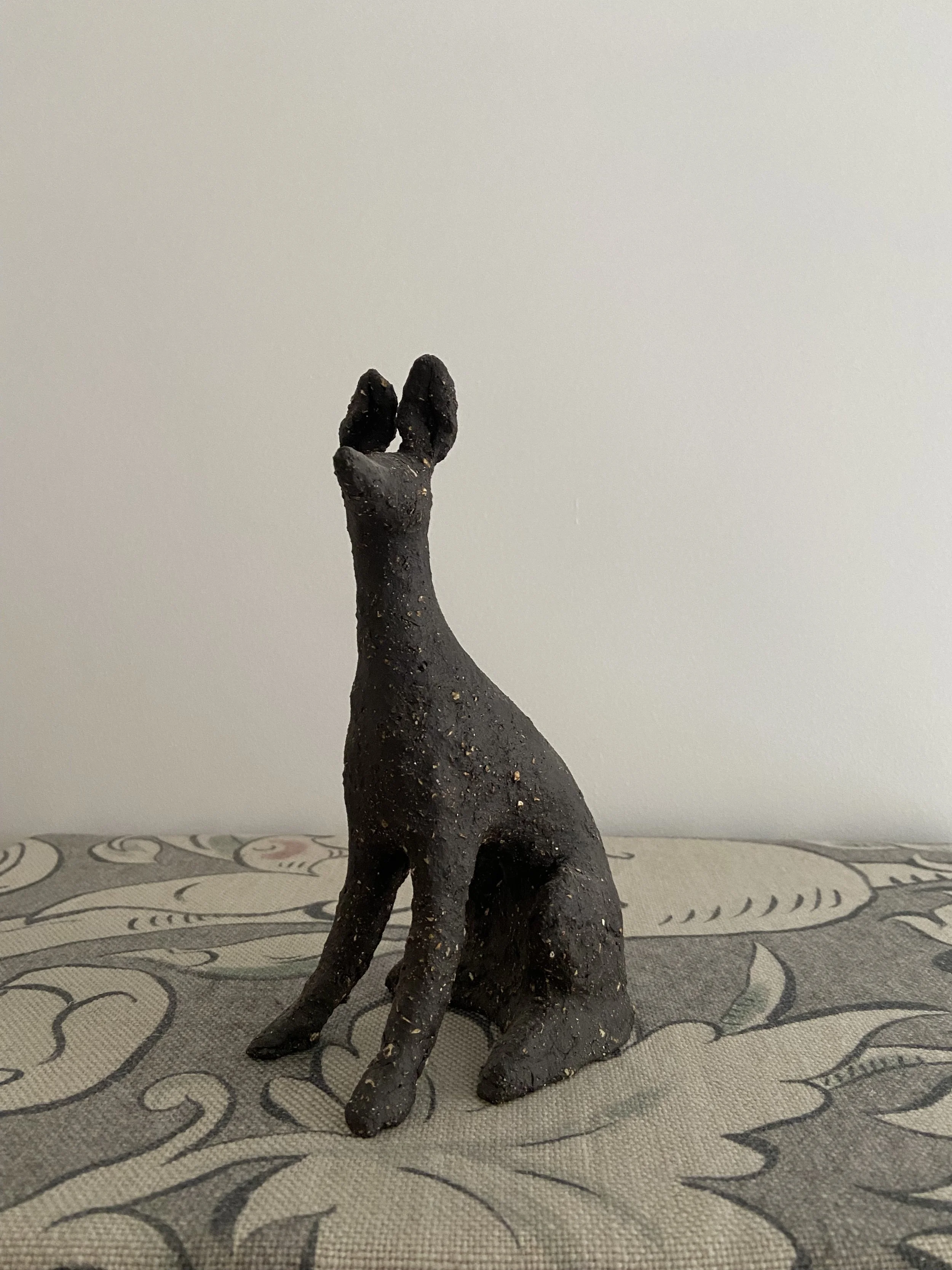 Stoneware seated hounds by Charlotte Salt