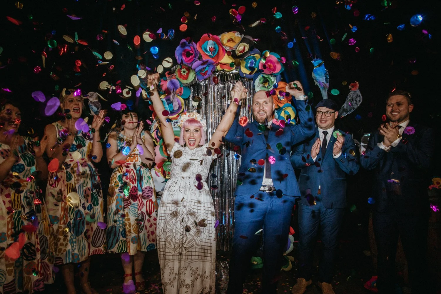 Colourful confetti at night time Melbourne city wedding ceremony with bride with pink hair