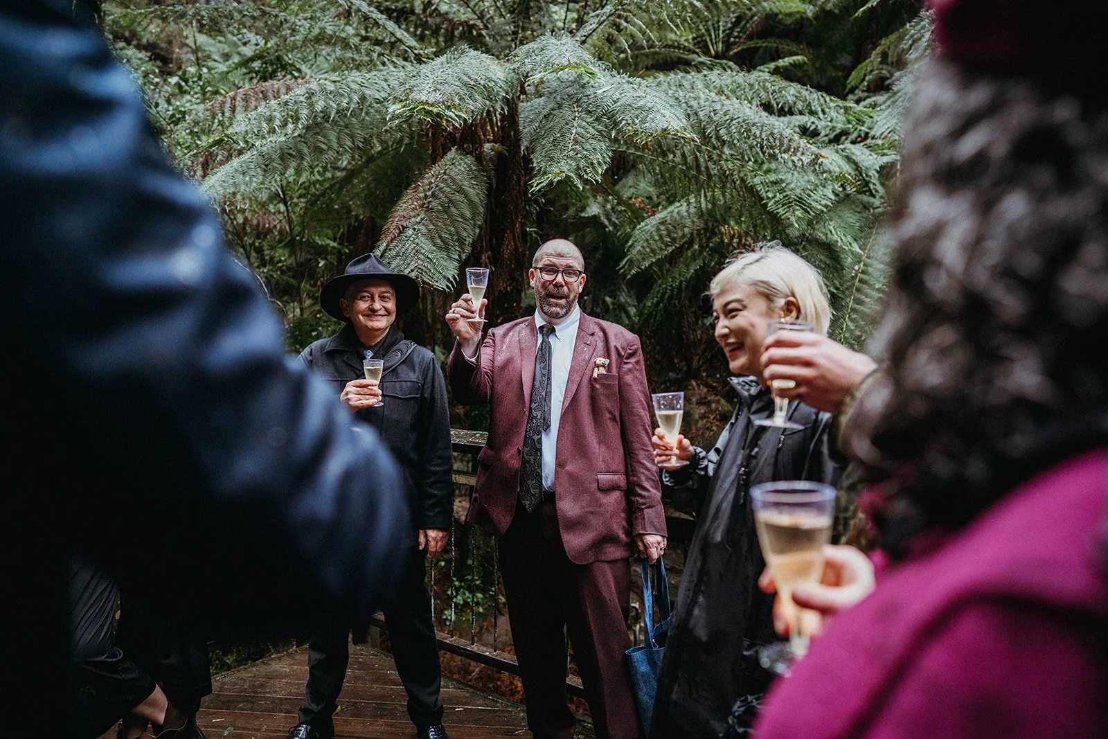 Mike and Jerome celebrating after their waterfall wedding ceremony