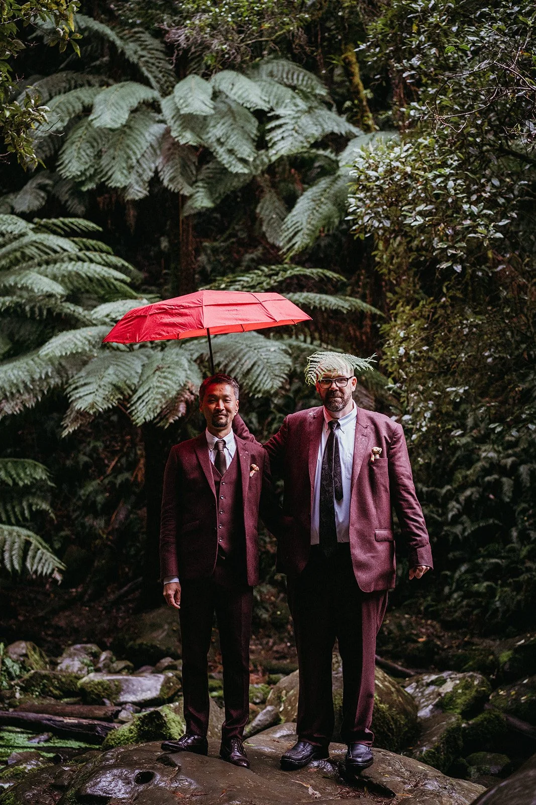 Tortoro inspired portraits for two handsome grooms on a very rainy day for their Erskine Falls elopement
