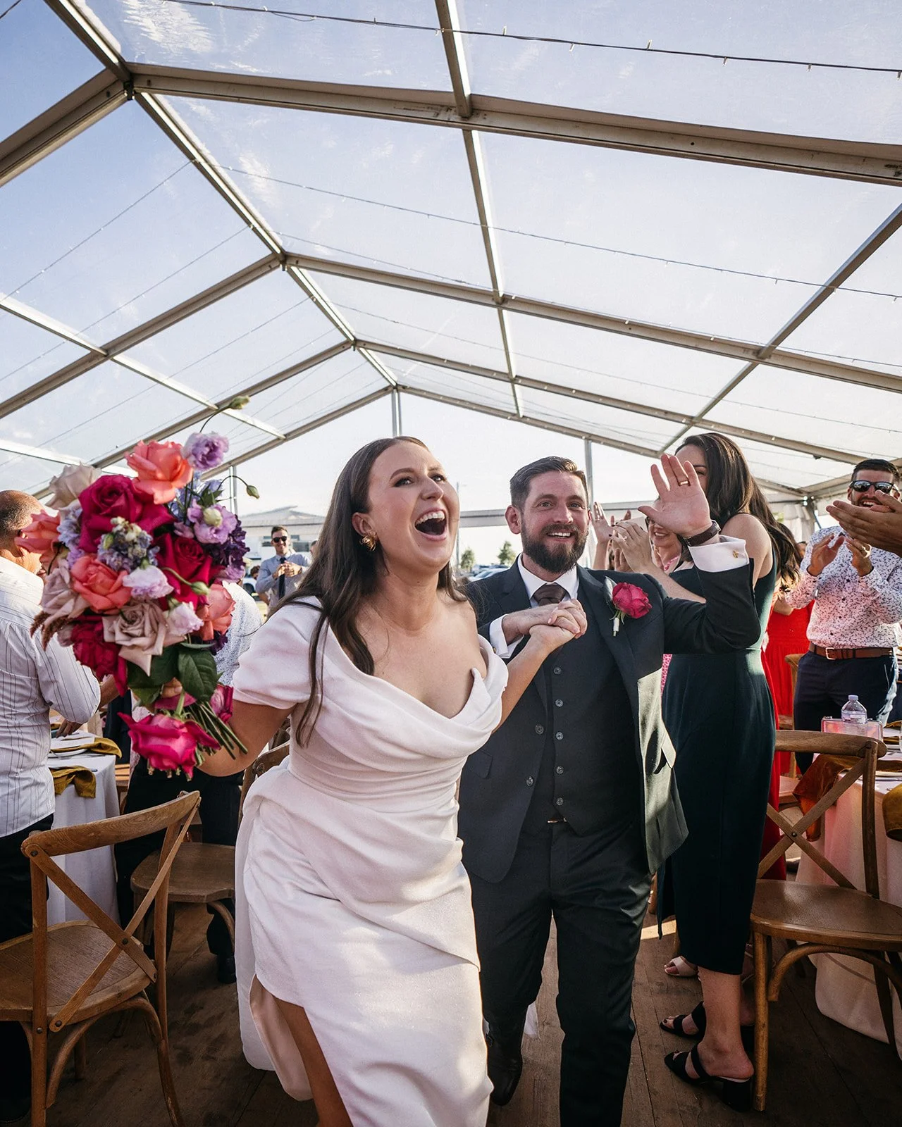 Bride laughing during wedding reception dance floor moments