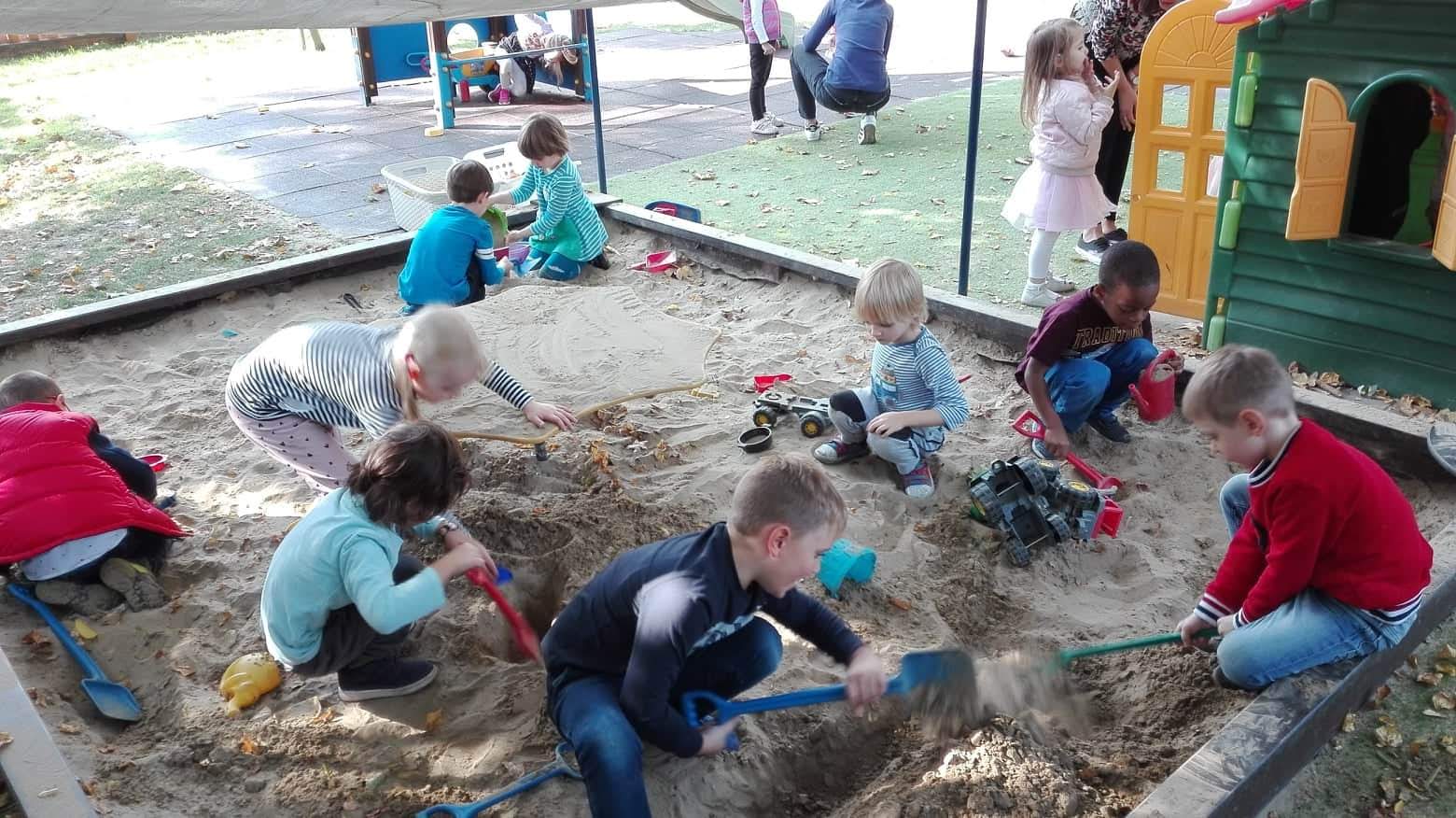 Children Playing in the Sand Pit