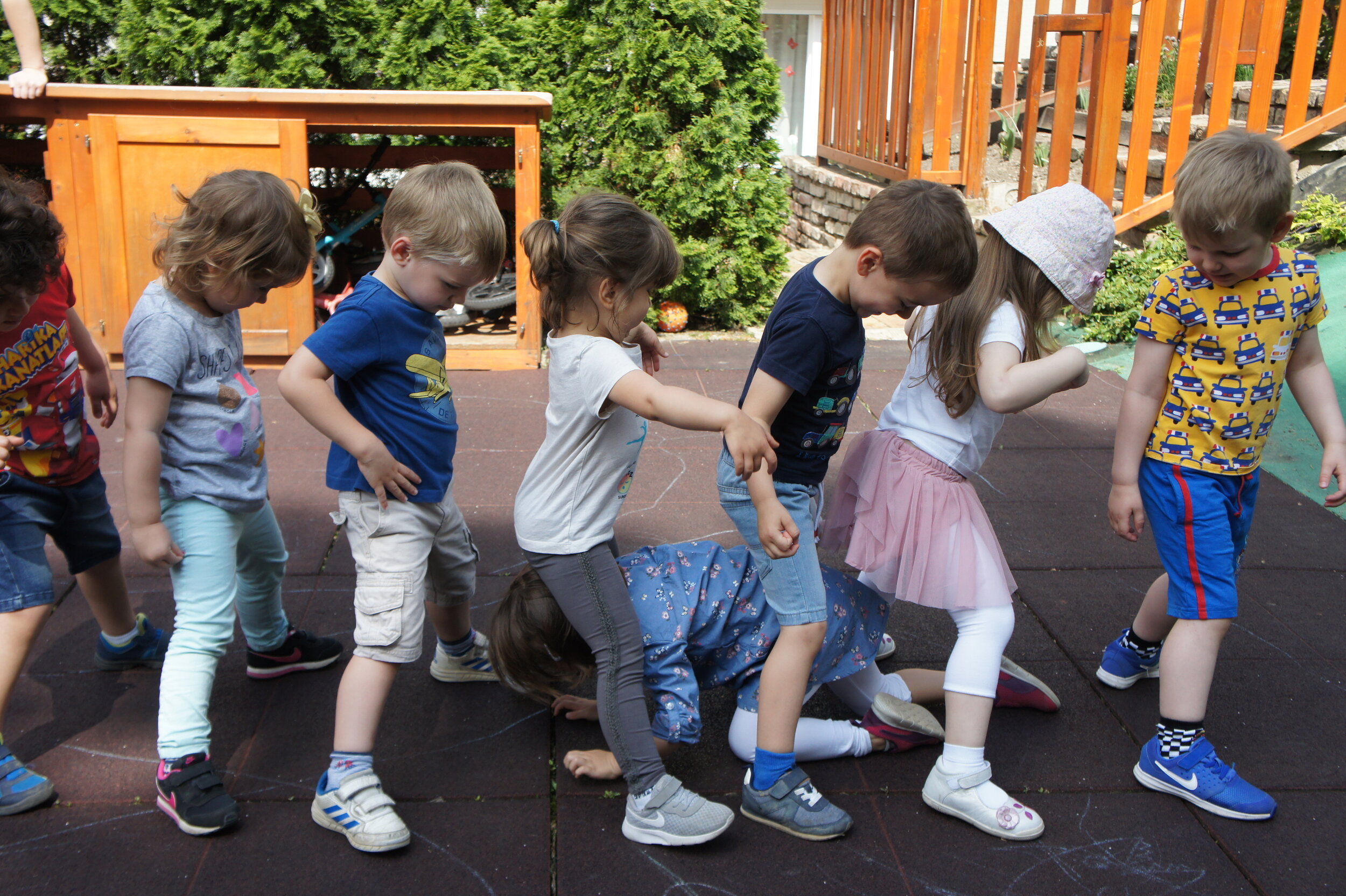 Nursery School Children Make a Leg Tunnel