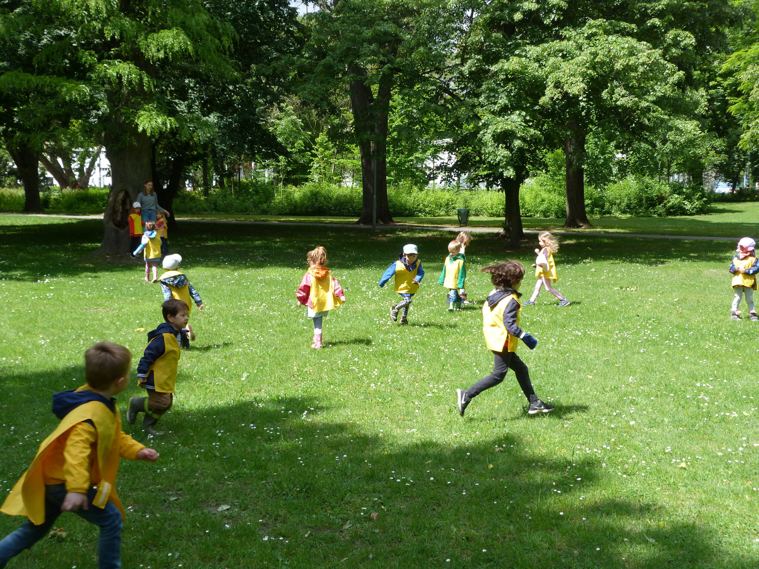 Children Running Across the Park