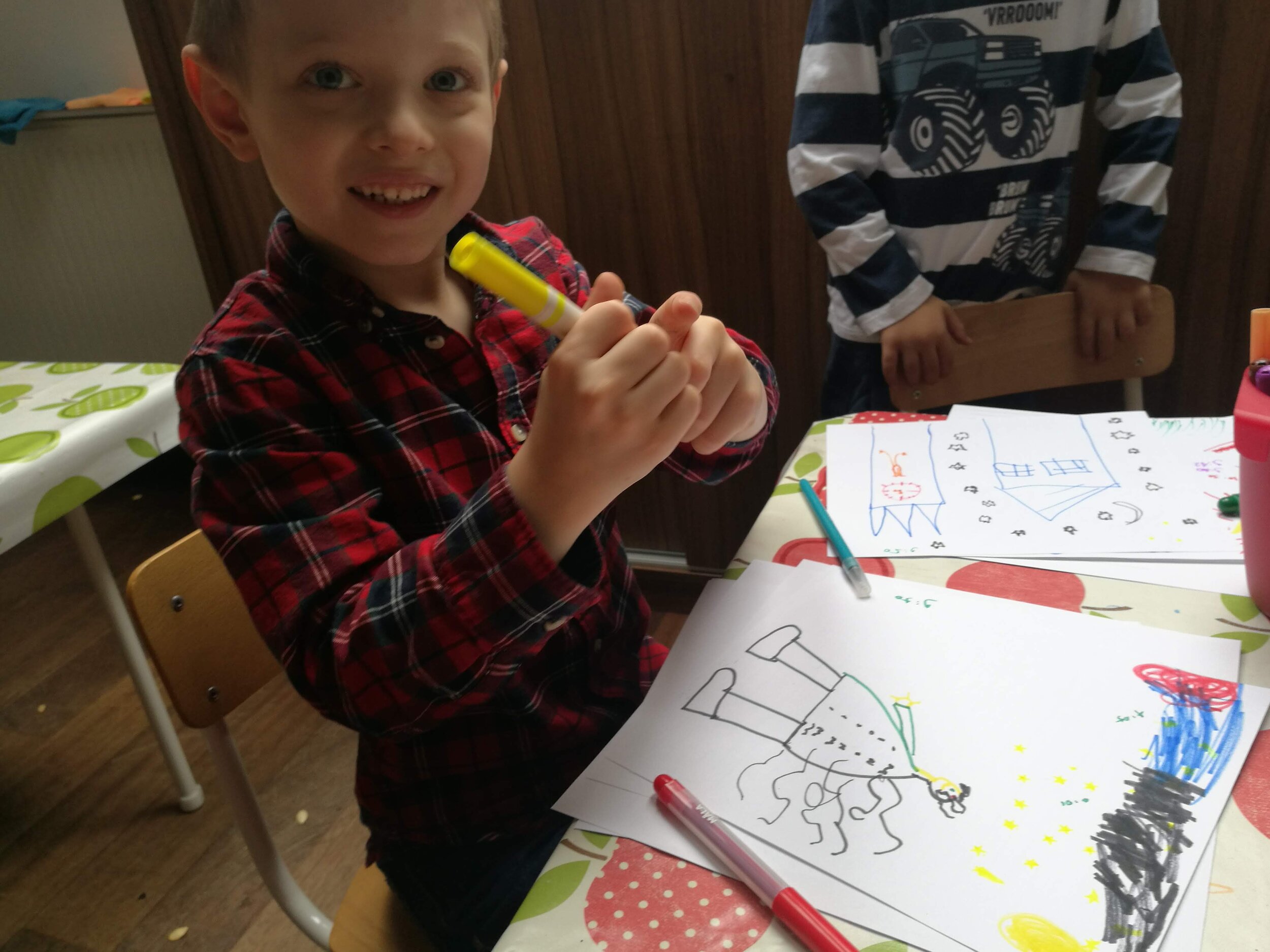 Boy Drawing with Colored Markers