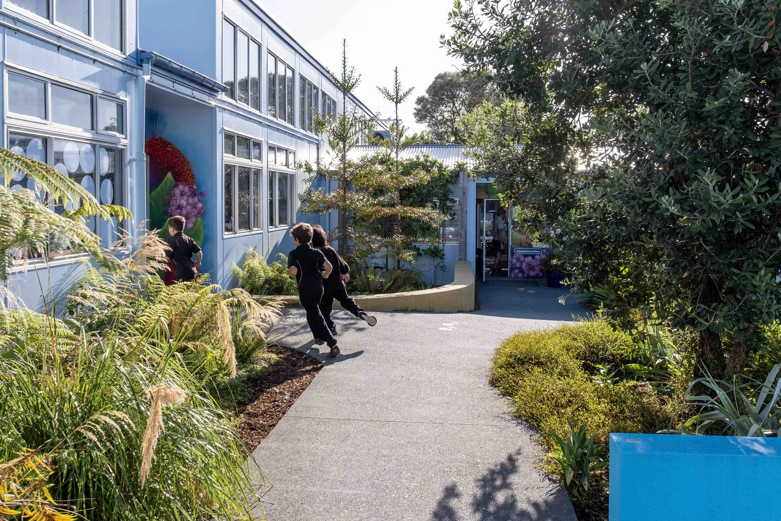 Students running through regenerative landscape architecture