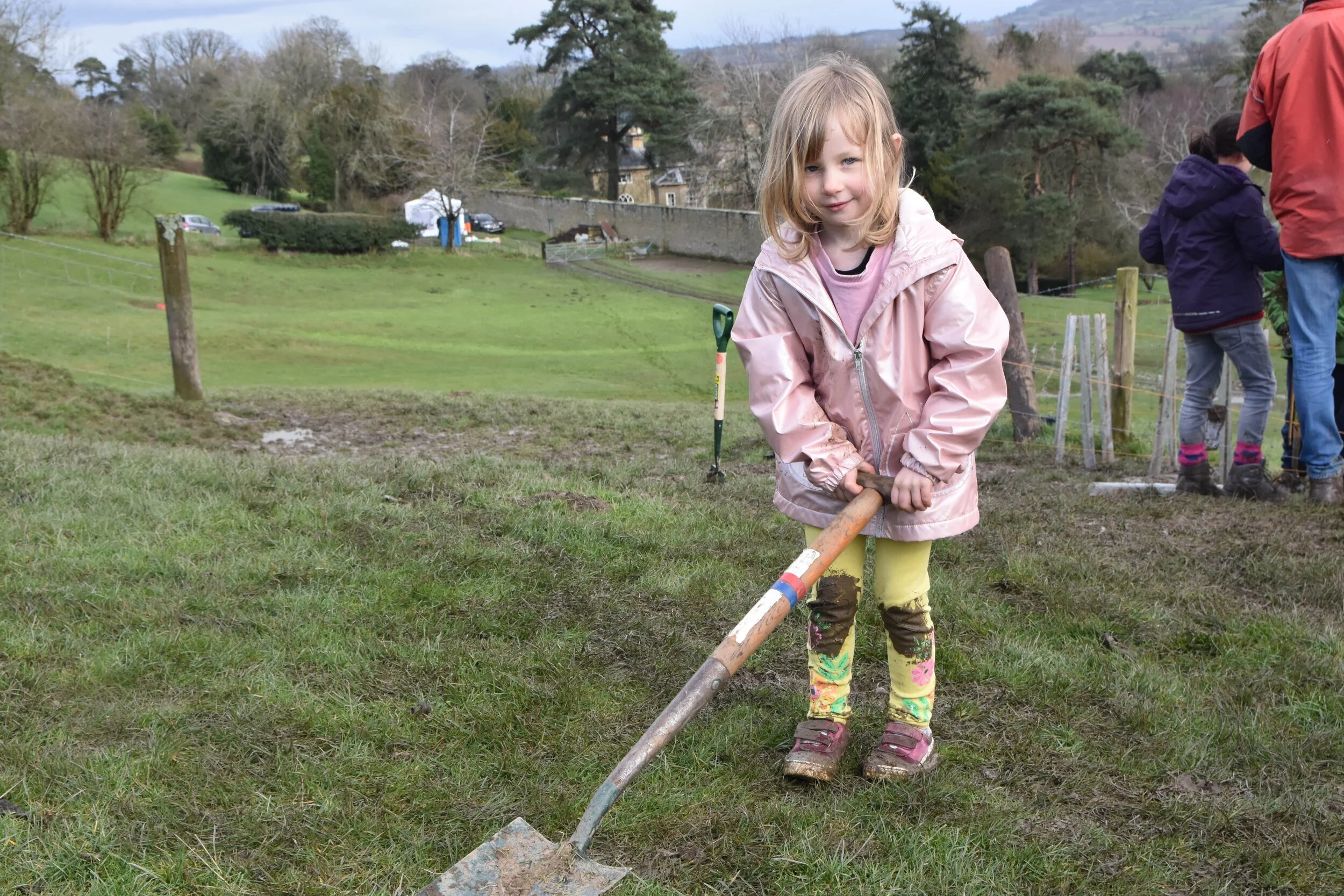 Cubs, villagers and climate activists come together to plant trees.