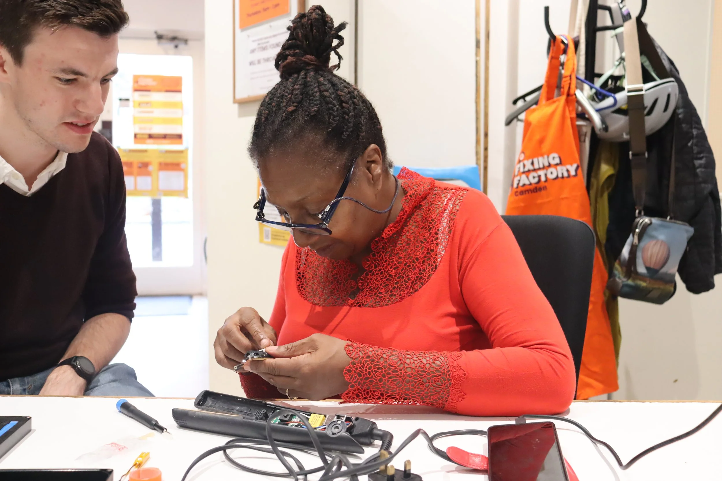 Volunteer Monica fixing hair straighteners.