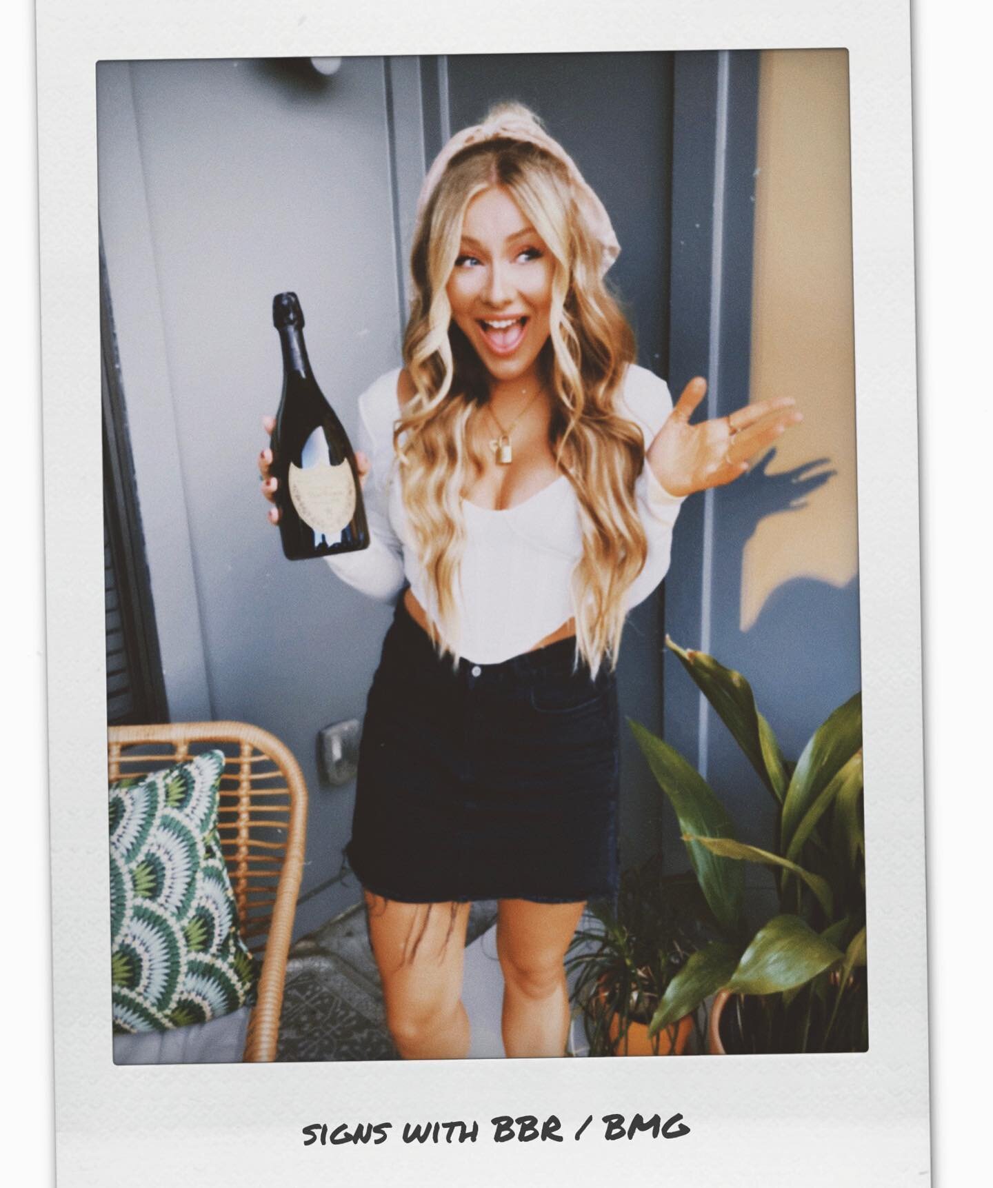 so excited to finally share the news that I get to join @bbrmusicgroup @bmgnashville incredible roster ✨🤍 the bottle of dom I&rsquo;m holding is one that I bought jan 3 2020 to drink &ldquo;when I signed a record deal &rdquo; it was always a when, n