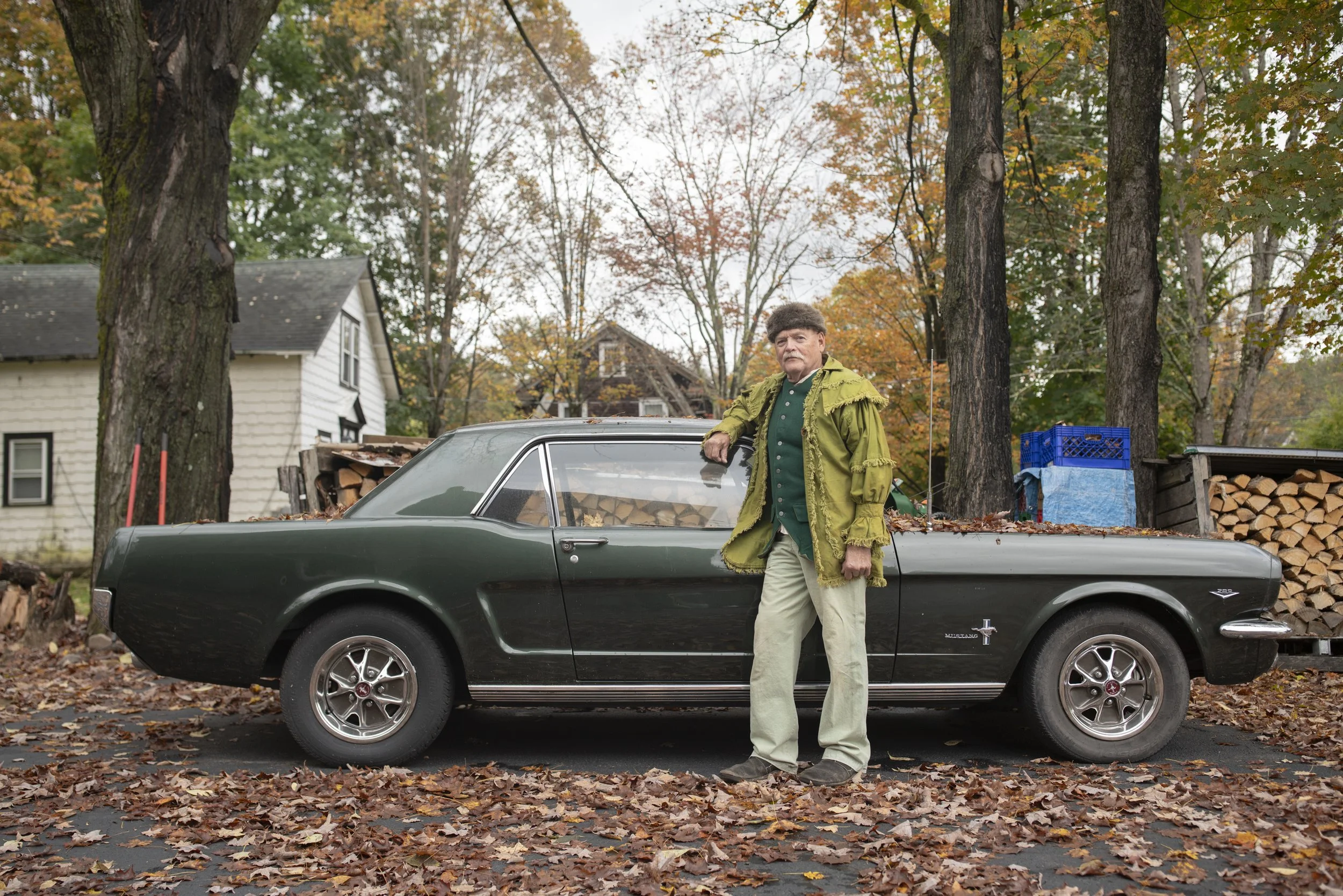  Dennis Bernitt poses with his Ford Mustang, dressed up in a Colonial-era outfit. Bernitt wore this during tours he would give around the area, highlighting the various historic landmarks. 