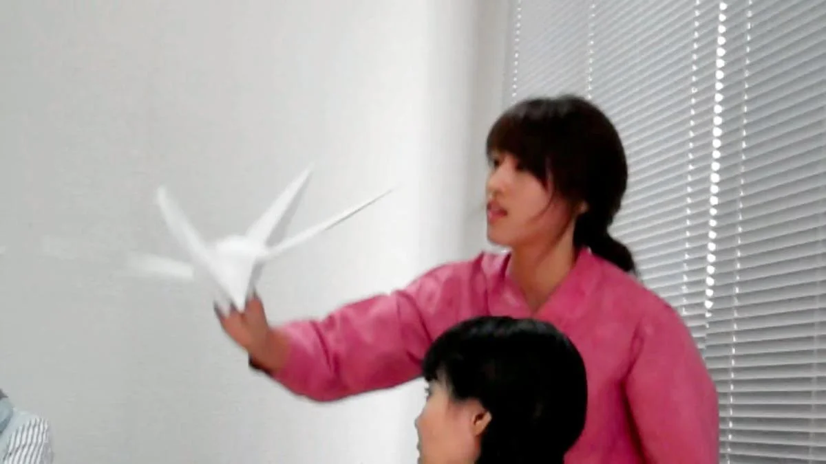 Playwright Hyemin Han (with crane) reading 'A Paper Crane' (Copy)