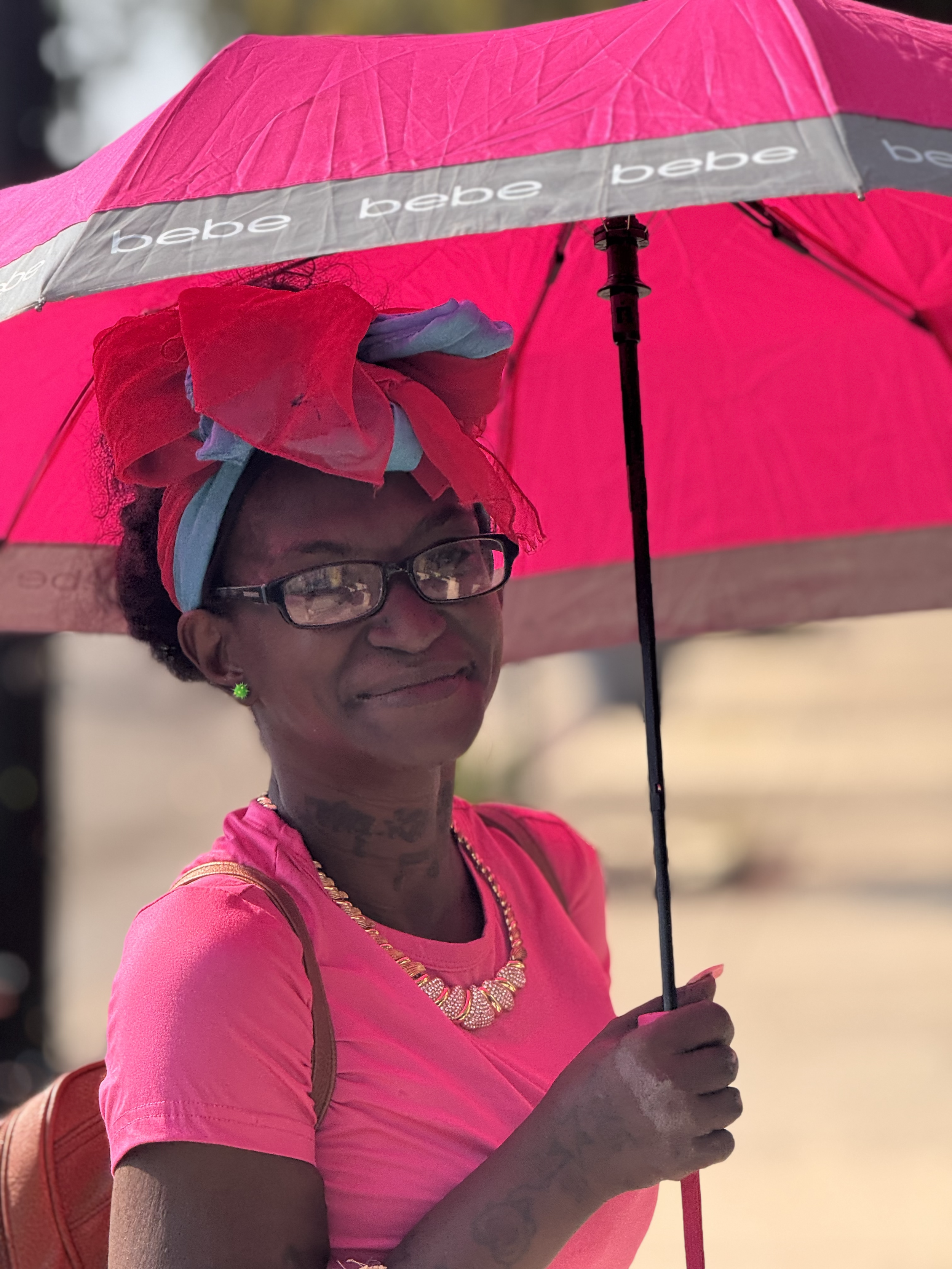 resident with pink umbrella.png