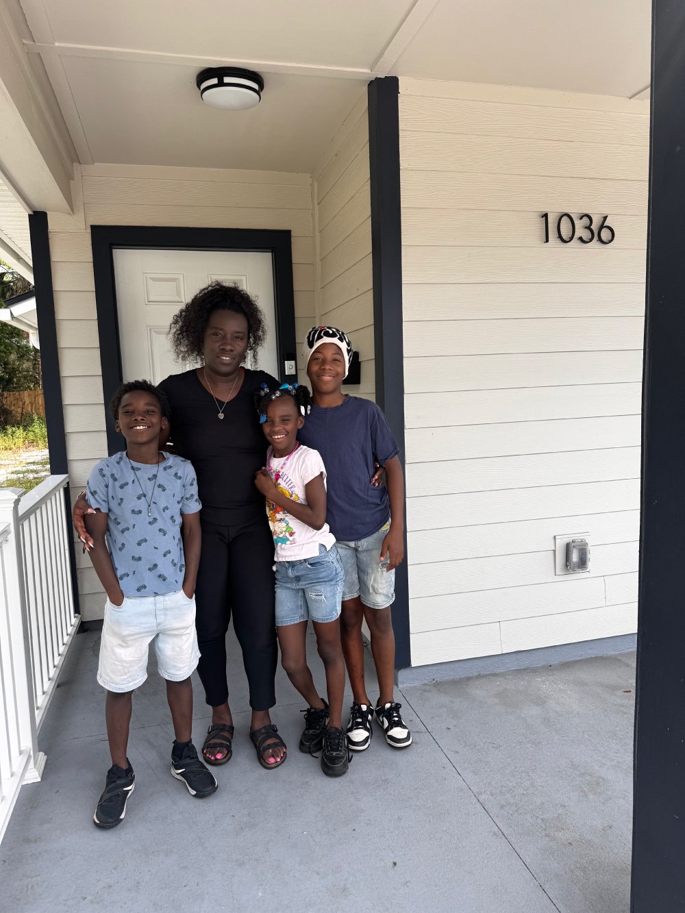Nikitra-and-fam-on-porch.jpg