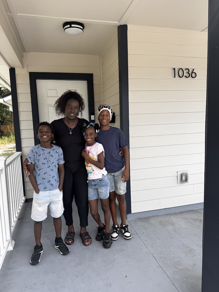 Nikitra and fam on porch.png