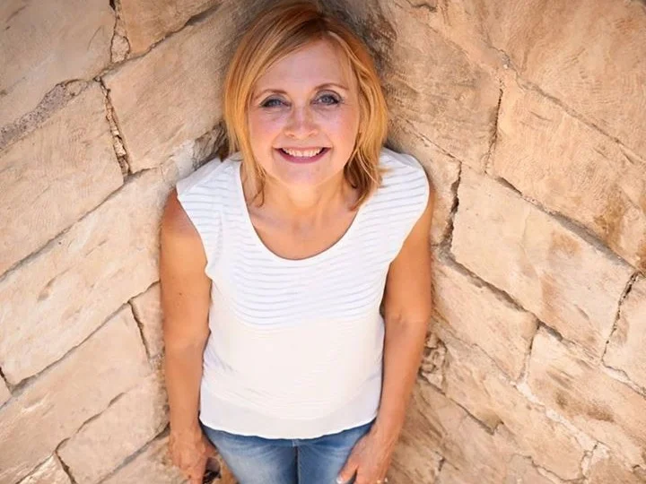 Elsa’s loves leading tours to the Lands of the Bible. (Elsa on Jerusalem’s Walls)